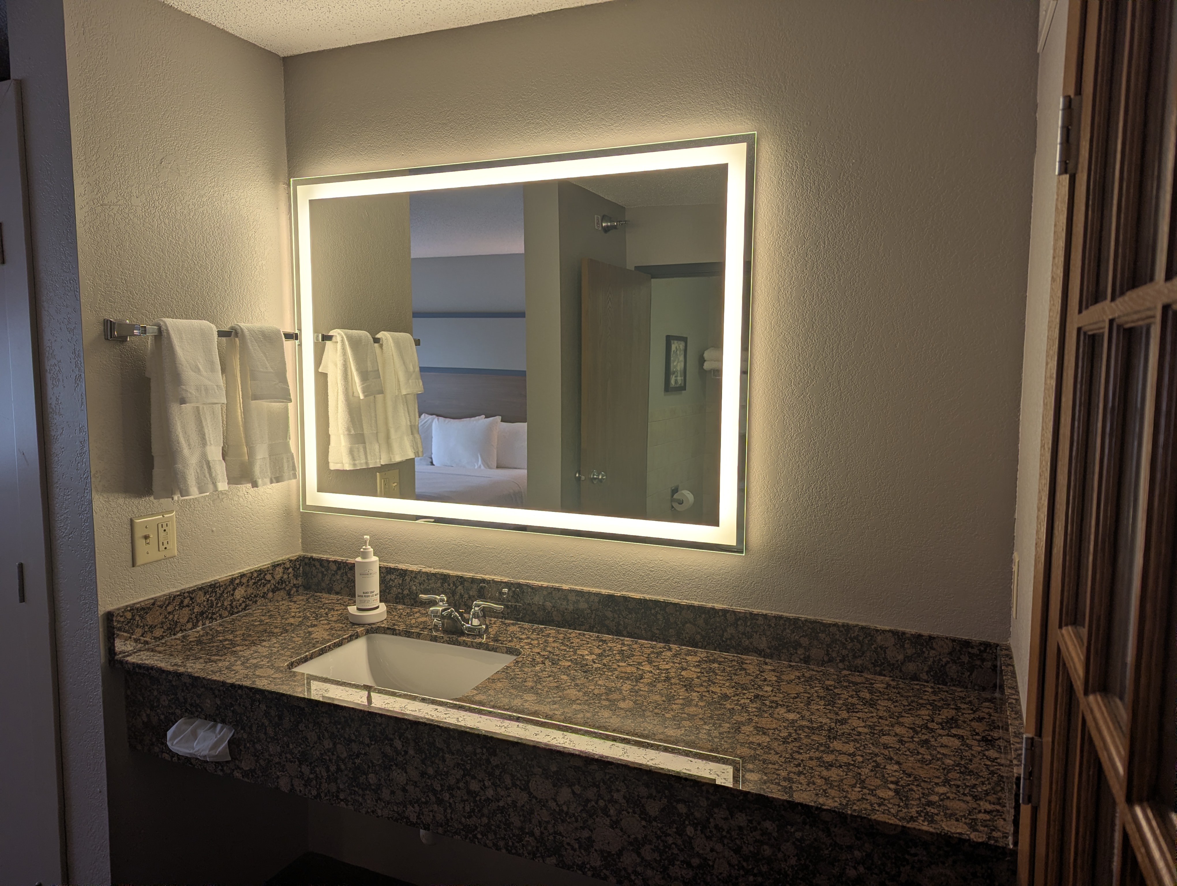 Guest room bath at the AmericInn by Wyndham St. Peter in Saint Peter, Minnesota