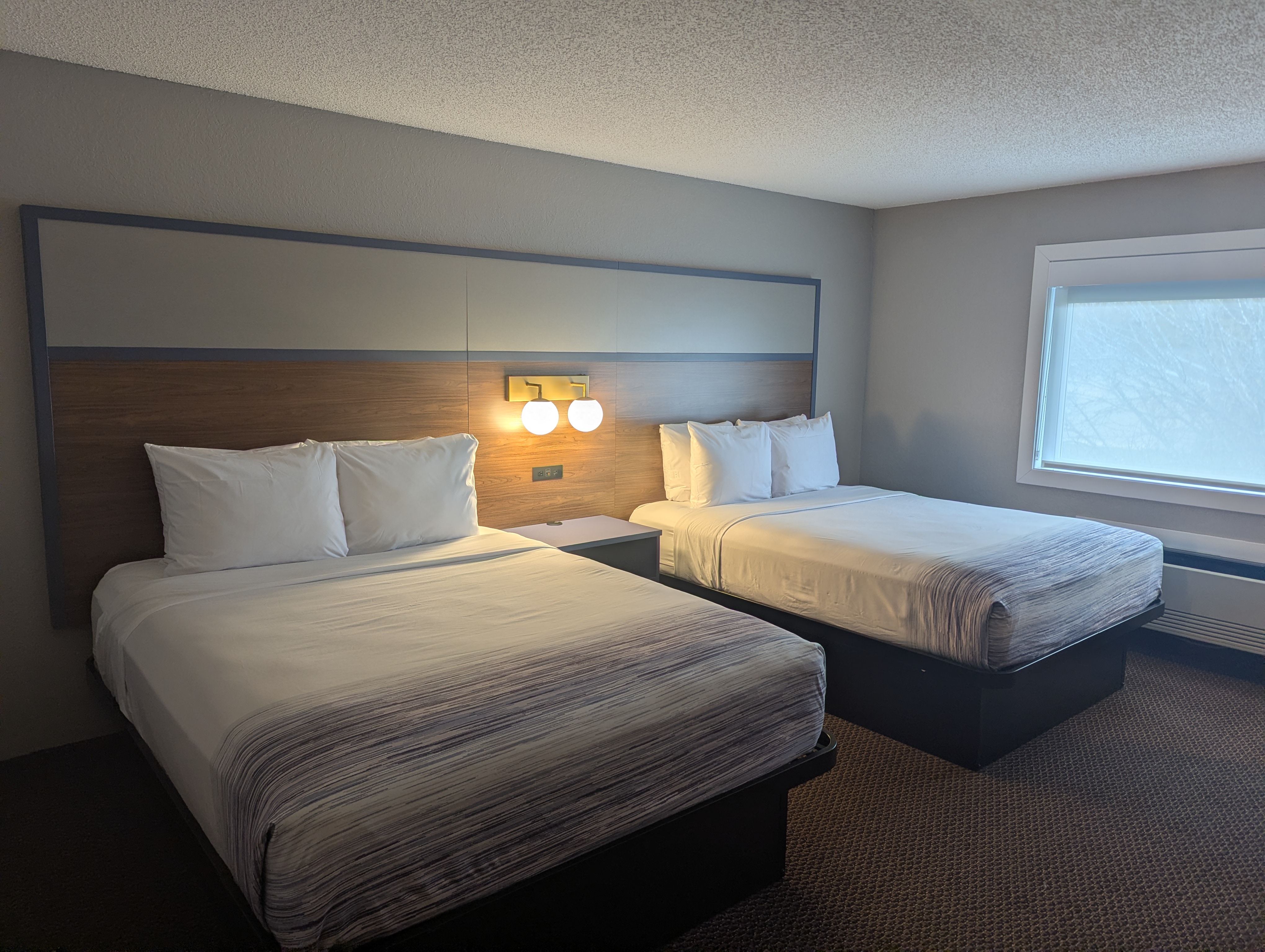 Guest room at the AmericInn by Wyndham St. Peter in Saint Peter, Minnesota