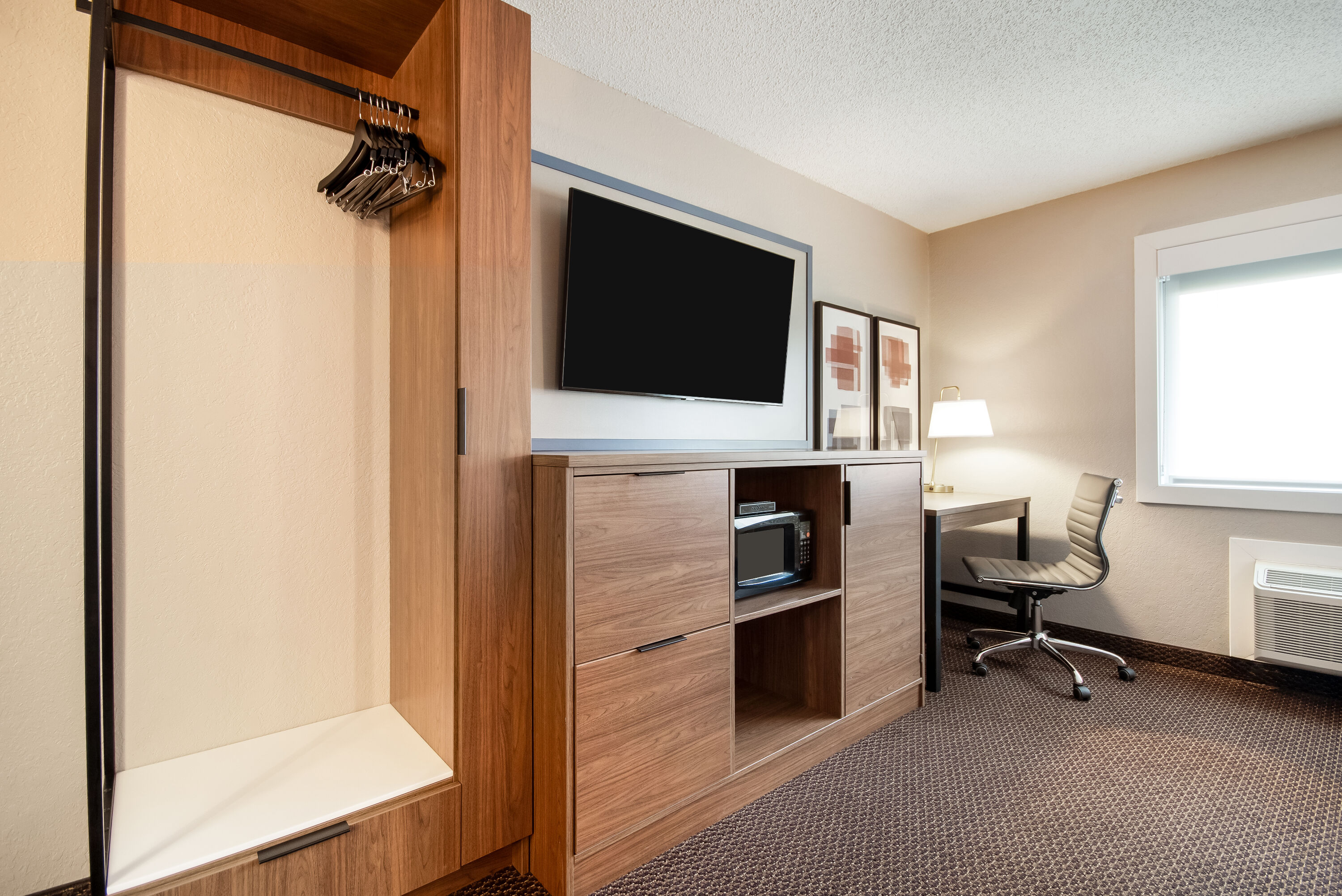 King bed guest room at the AmericInn by Wyndham St. Peter in Saint Peter, Minnesota