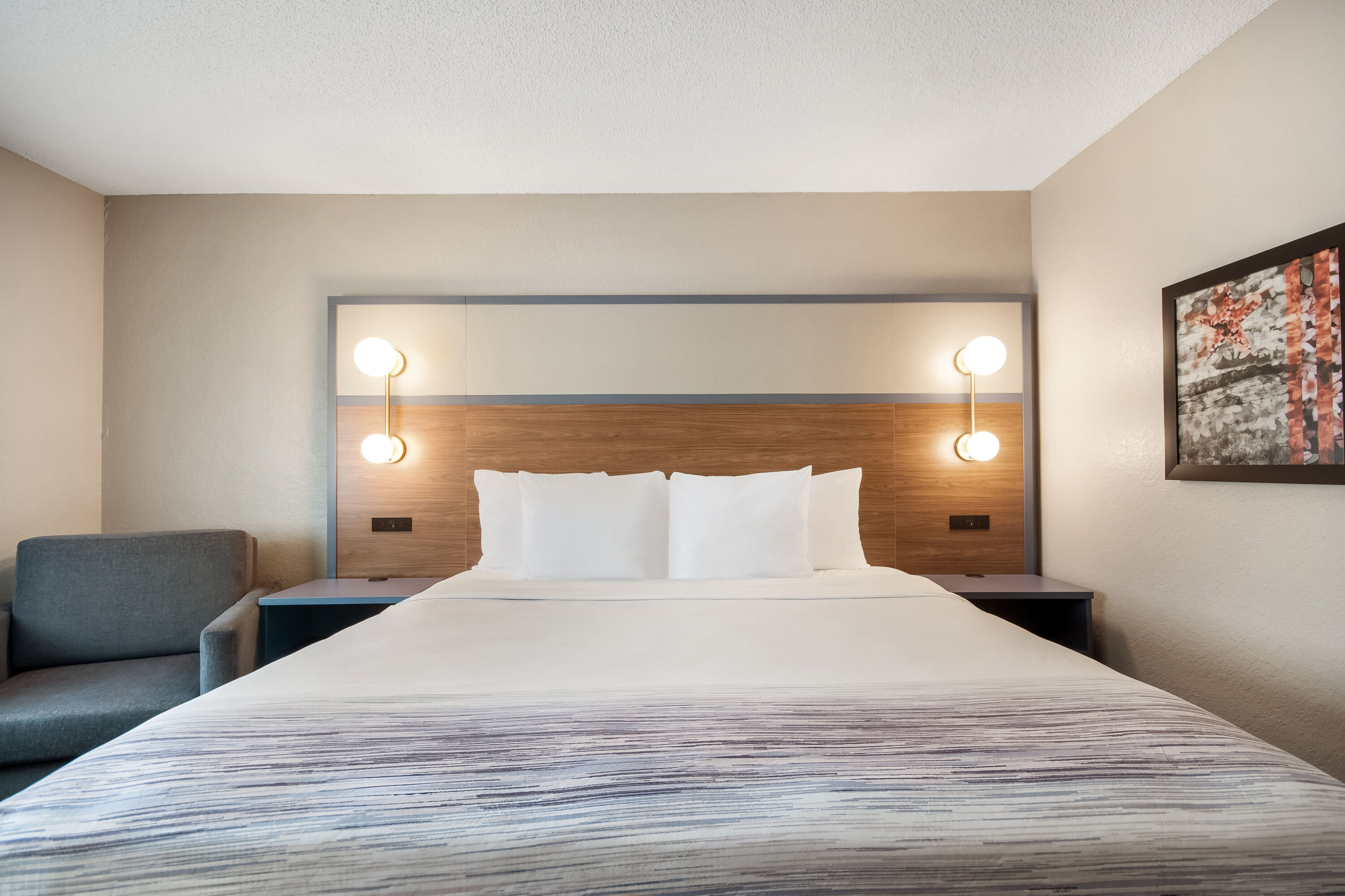 King bed guest room at the AmericInn by Wyndham St. Peter in Saint Peter, Minnesota