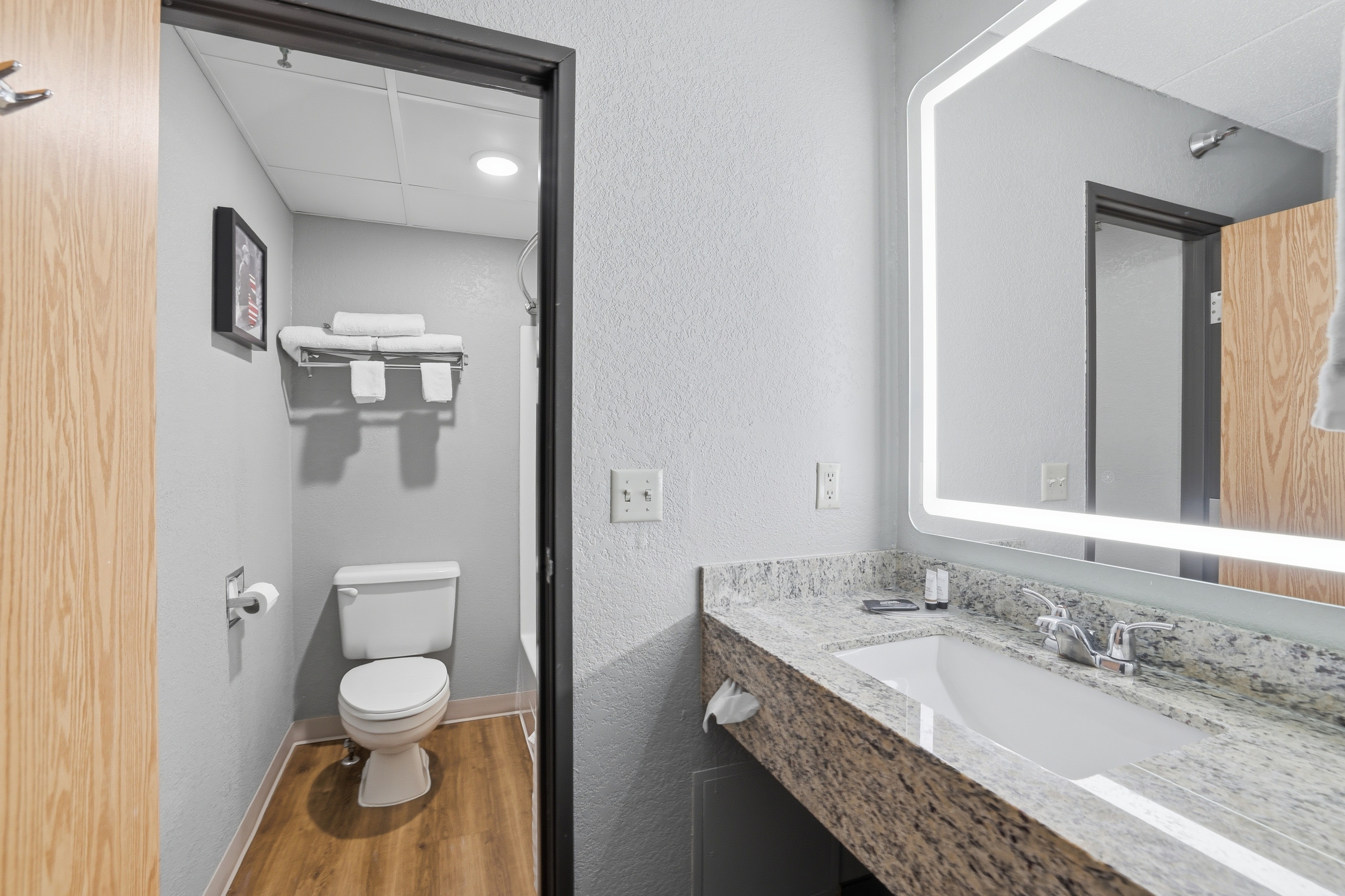 Guest room bath at the AmericInn by Wyndham White Bear Lake St. Paul in White Bear Lake, Minnesota