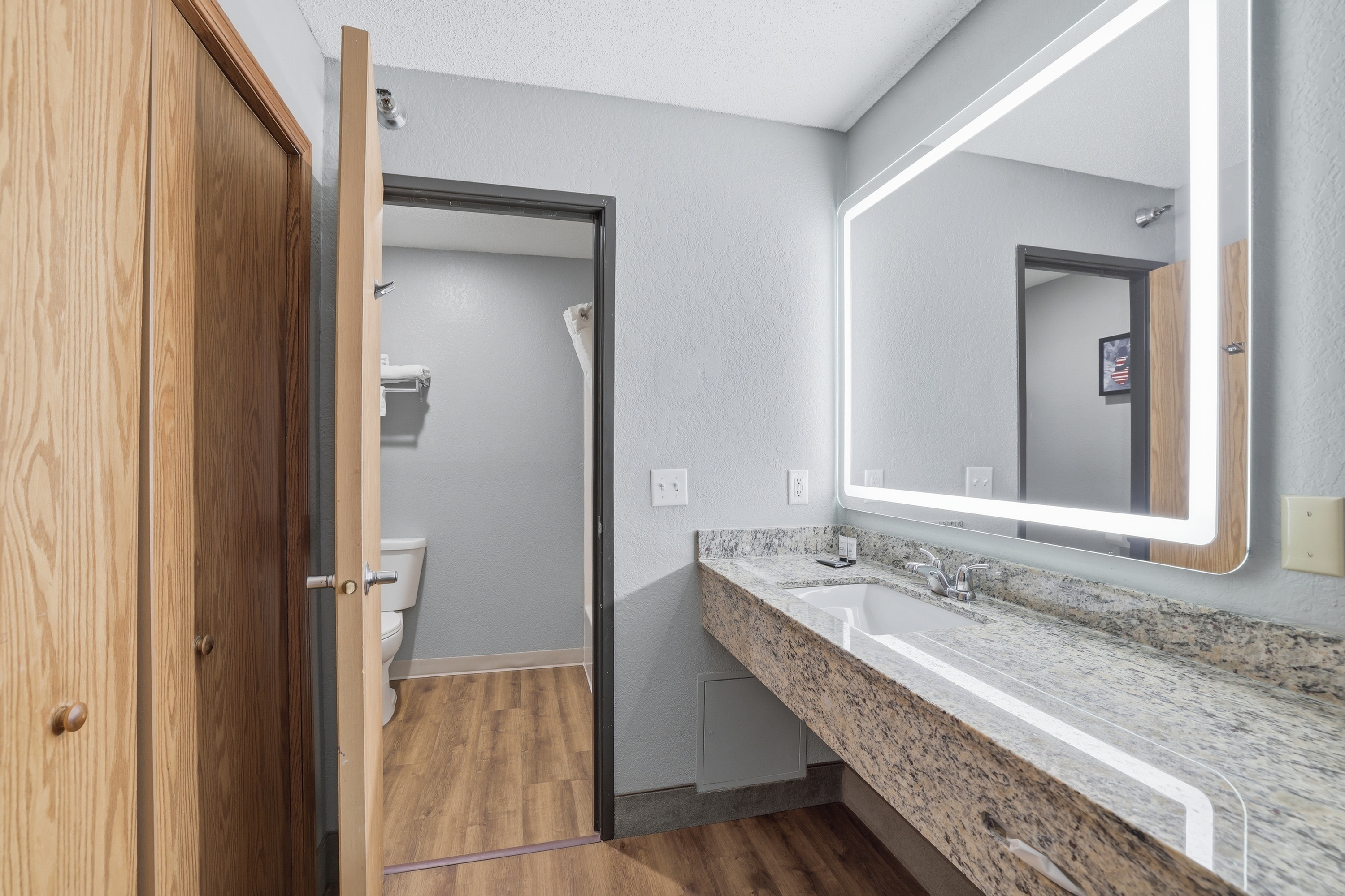 Guest room bath at the AmericInn by Wyndham White Bear Lake St. Paul in White Bear Lake, Minnesota