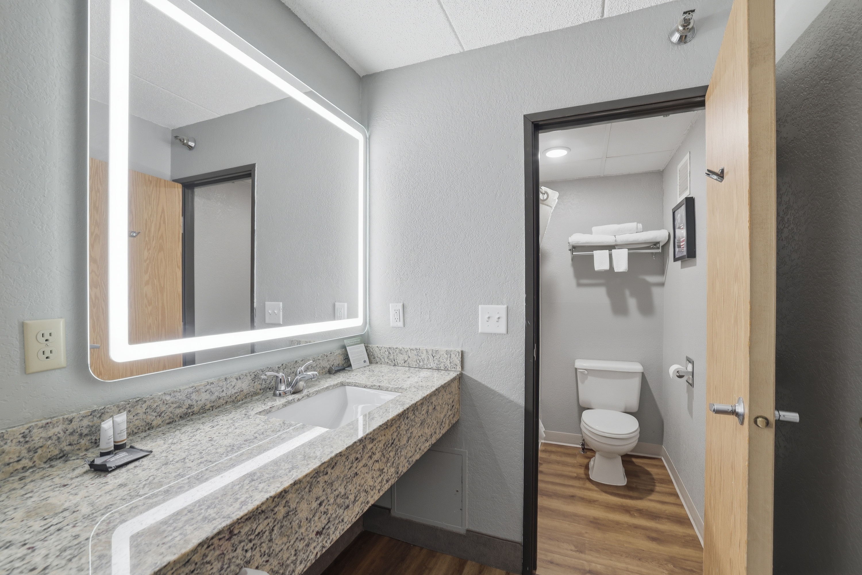 Guest room bath at the AmericInn by Wyndham White Bear Lake St. Paul in White Bear Lake, Minnesota