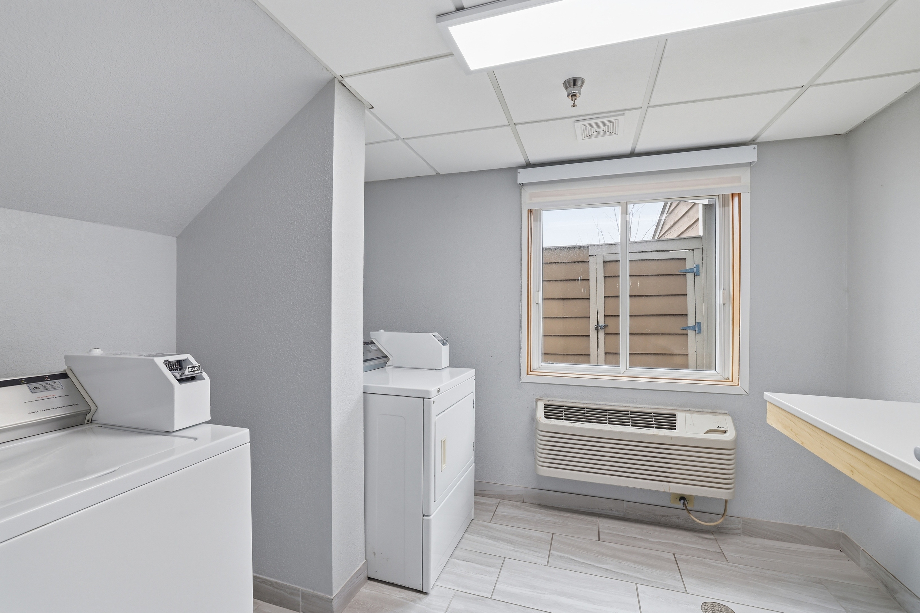 Laundry facilities at AmericInn by Wyndham White Bear Lake St. Paul in White Bear Lake, Minnesota