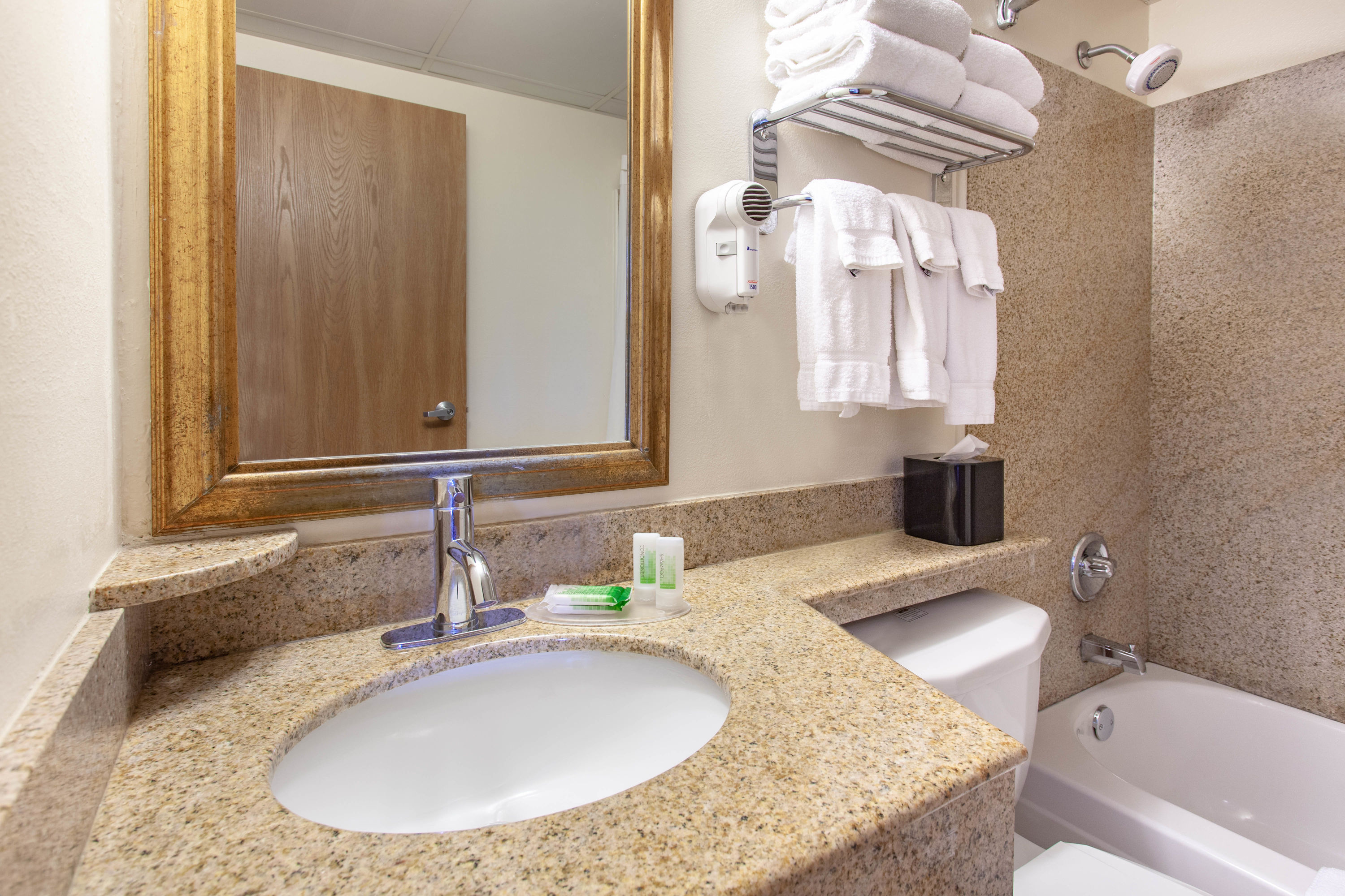 Guest room bath at the AmericInn by Wyndham Willmar in Willmar, Minnesota