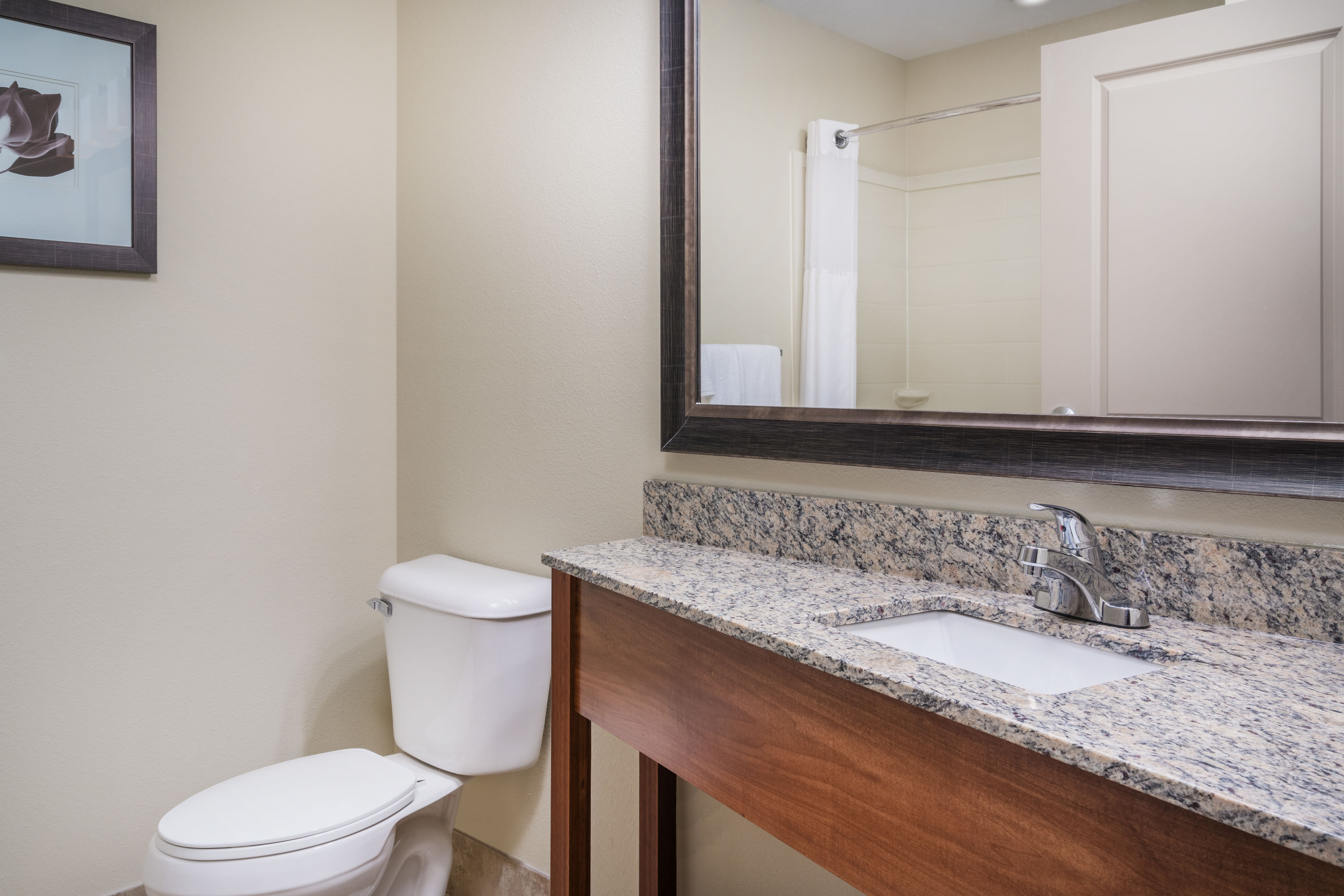 Guest room bath at the AmericInn by Wyndham Winona in Winona, Minnesota