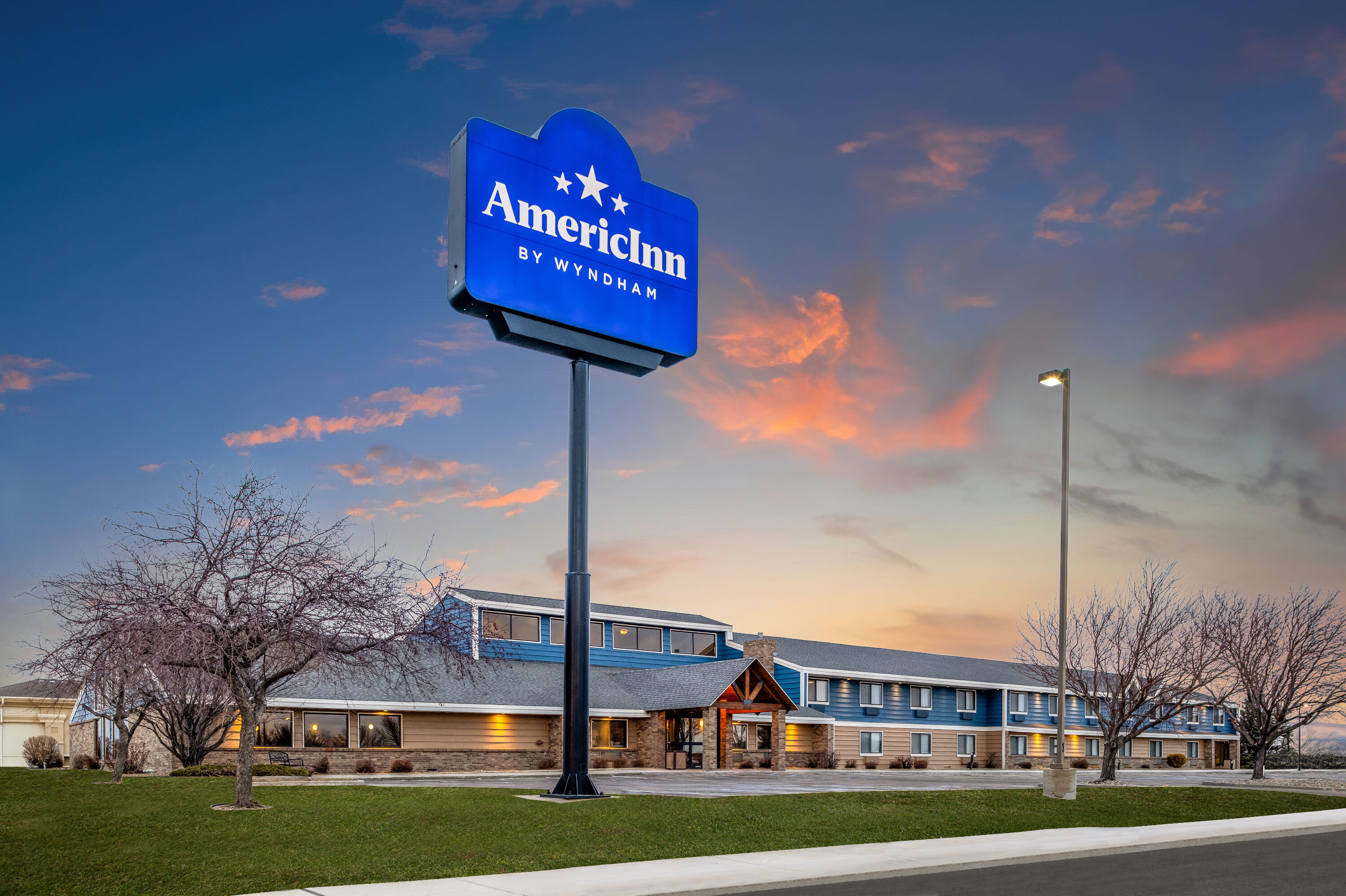 Exterior Dusk Image of AmericInn by Wyndham Bismarck hotel in Bismarck, North Dakota