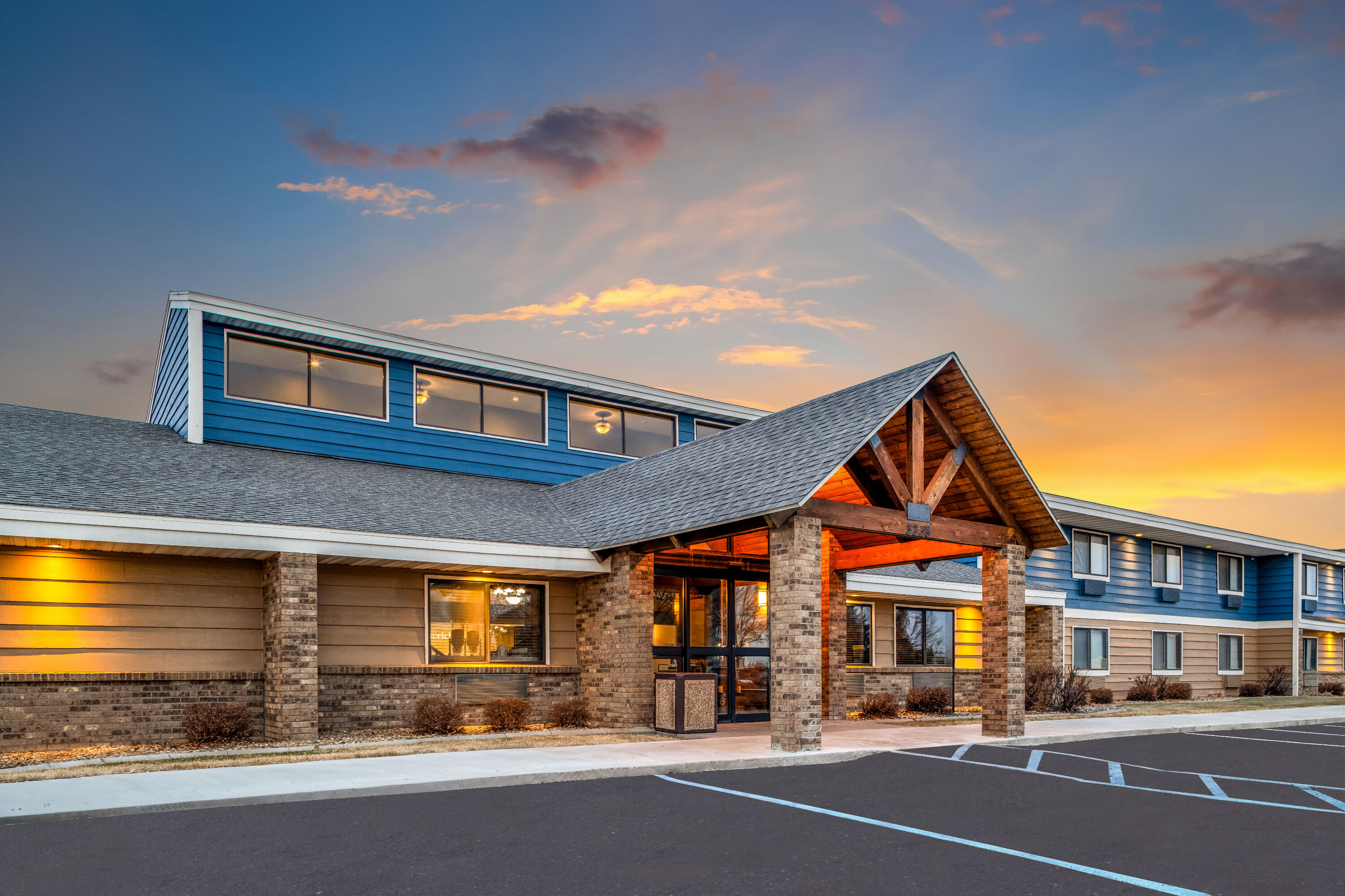 Exterior Dusk Image of AmericInn by Wyndham Bismarck hotel in Bismarck, North Dakota