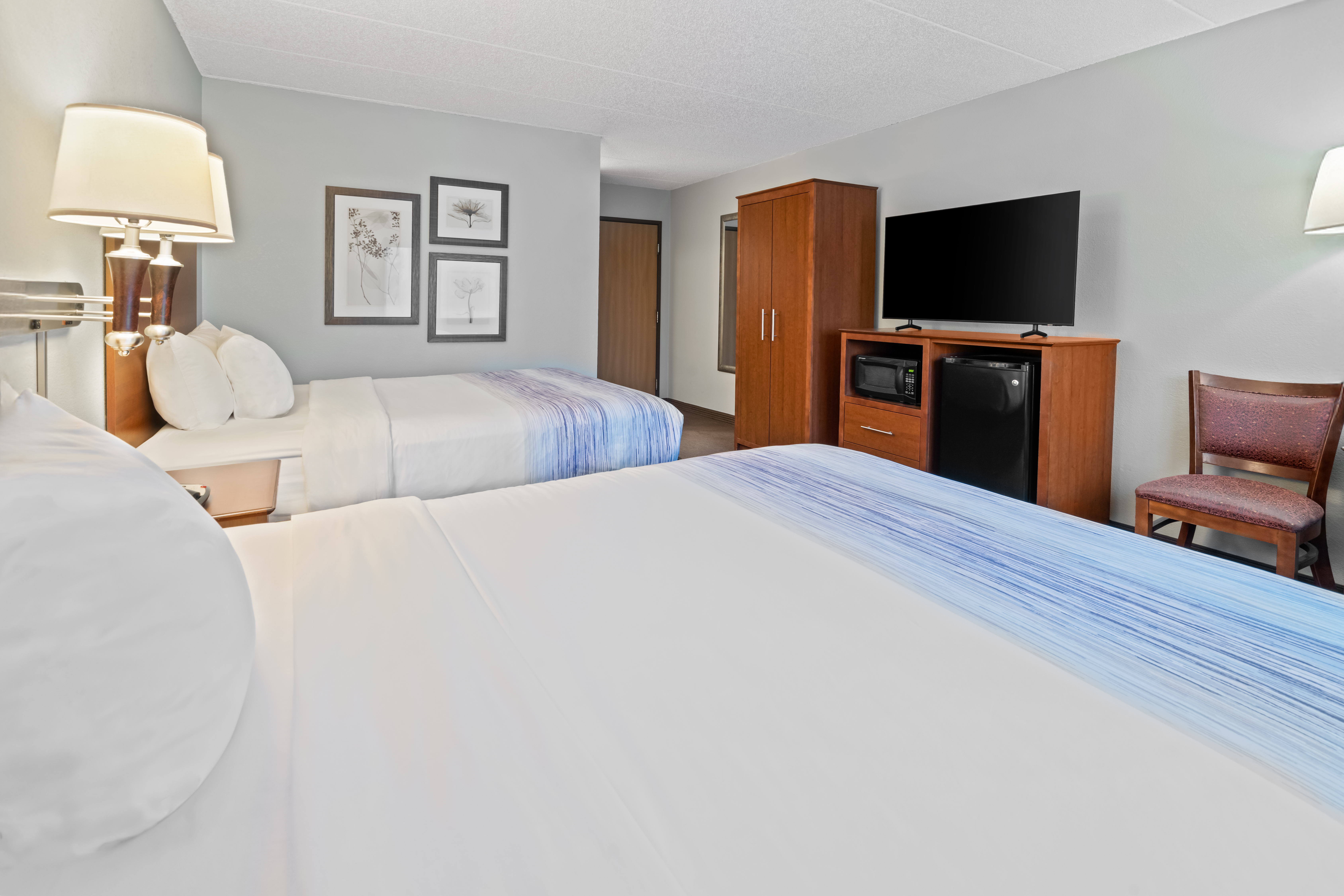 Guest room at the AmericInn by Wyndham Bismarck in Bismarck, North Dakota