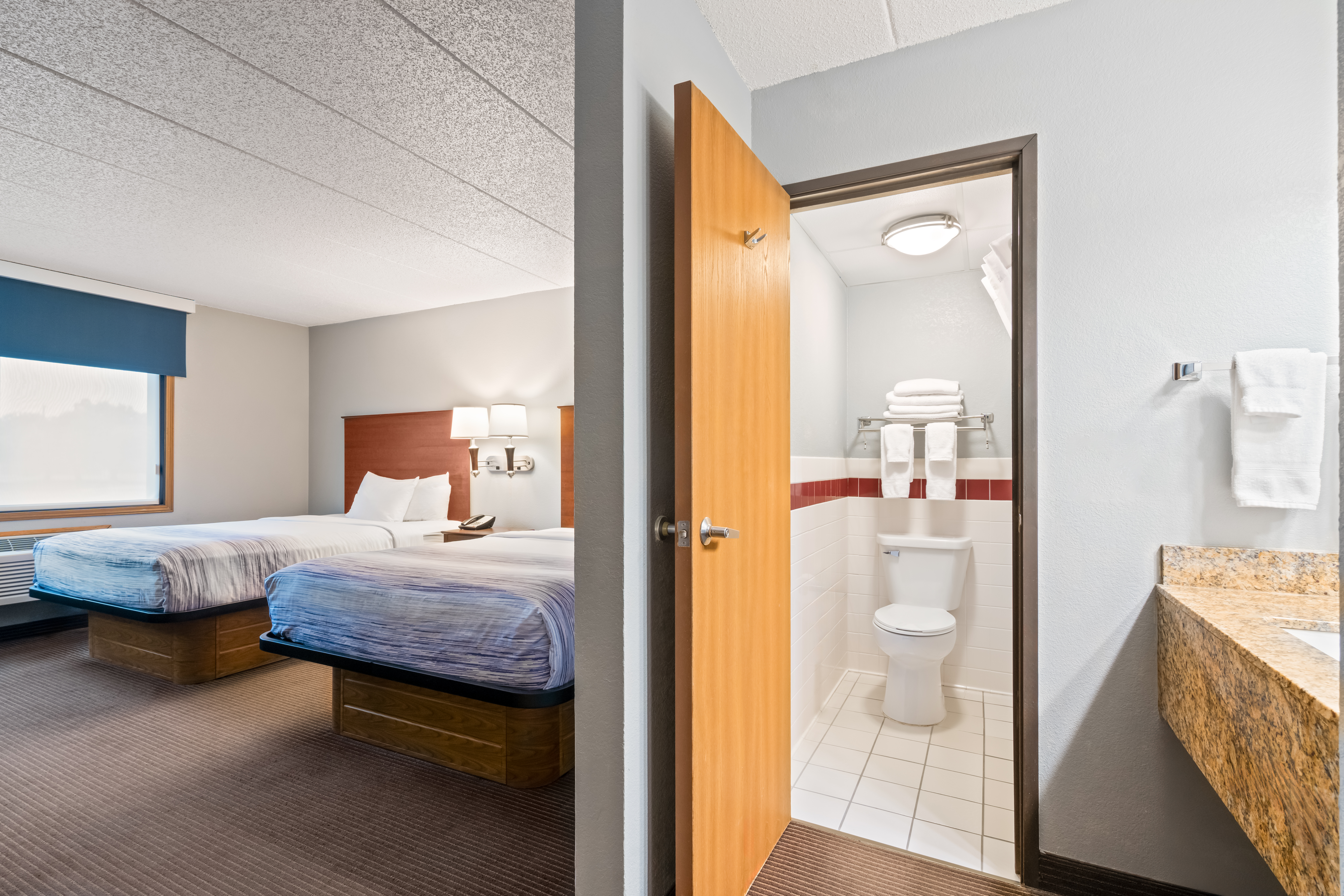 Guest room at the AmericInn by Wyndham Bismarck in Bismarck, North Dakota
