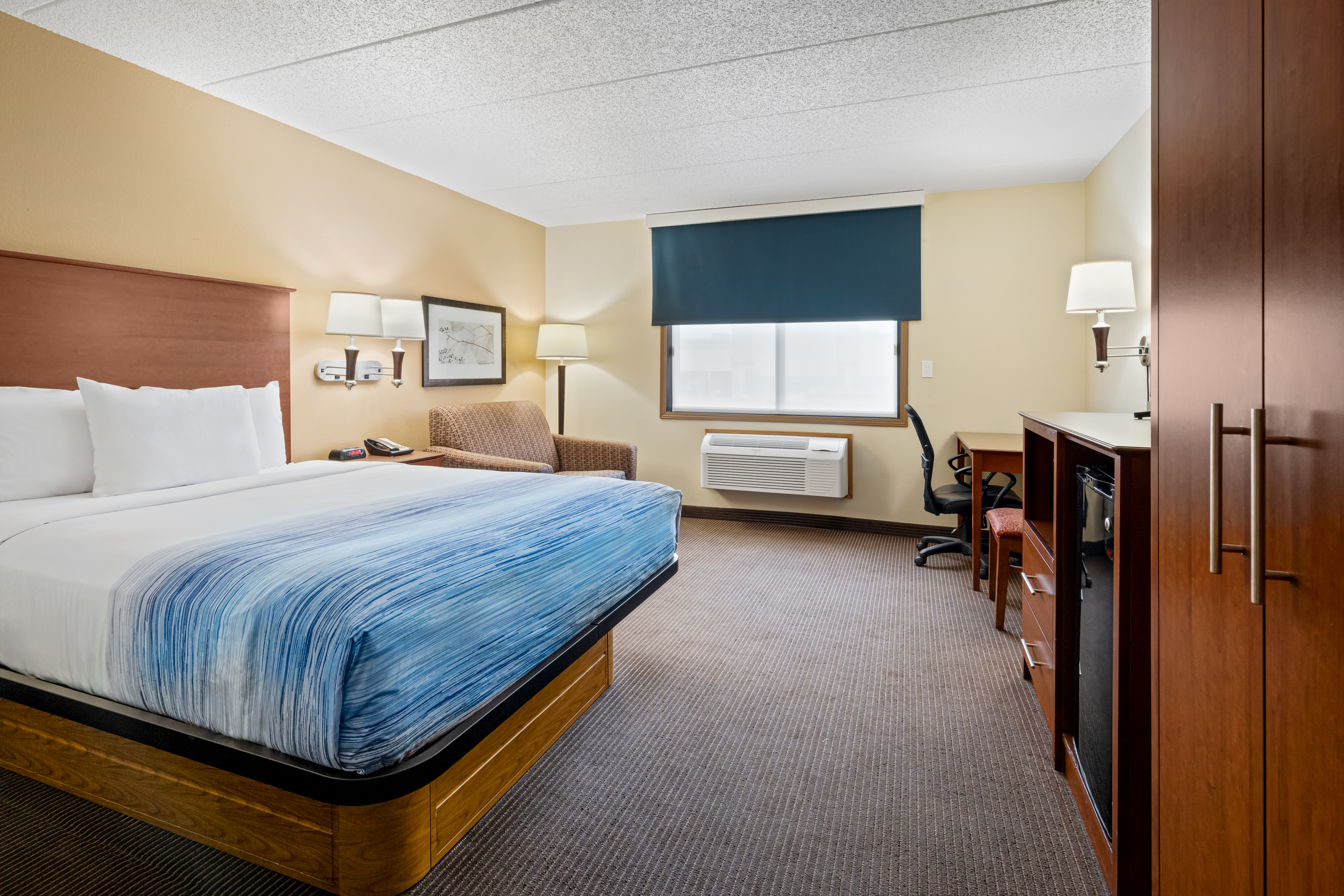 Guest room at the AmericInn by Wyndham Bismarck in Bismarck, North Dakota