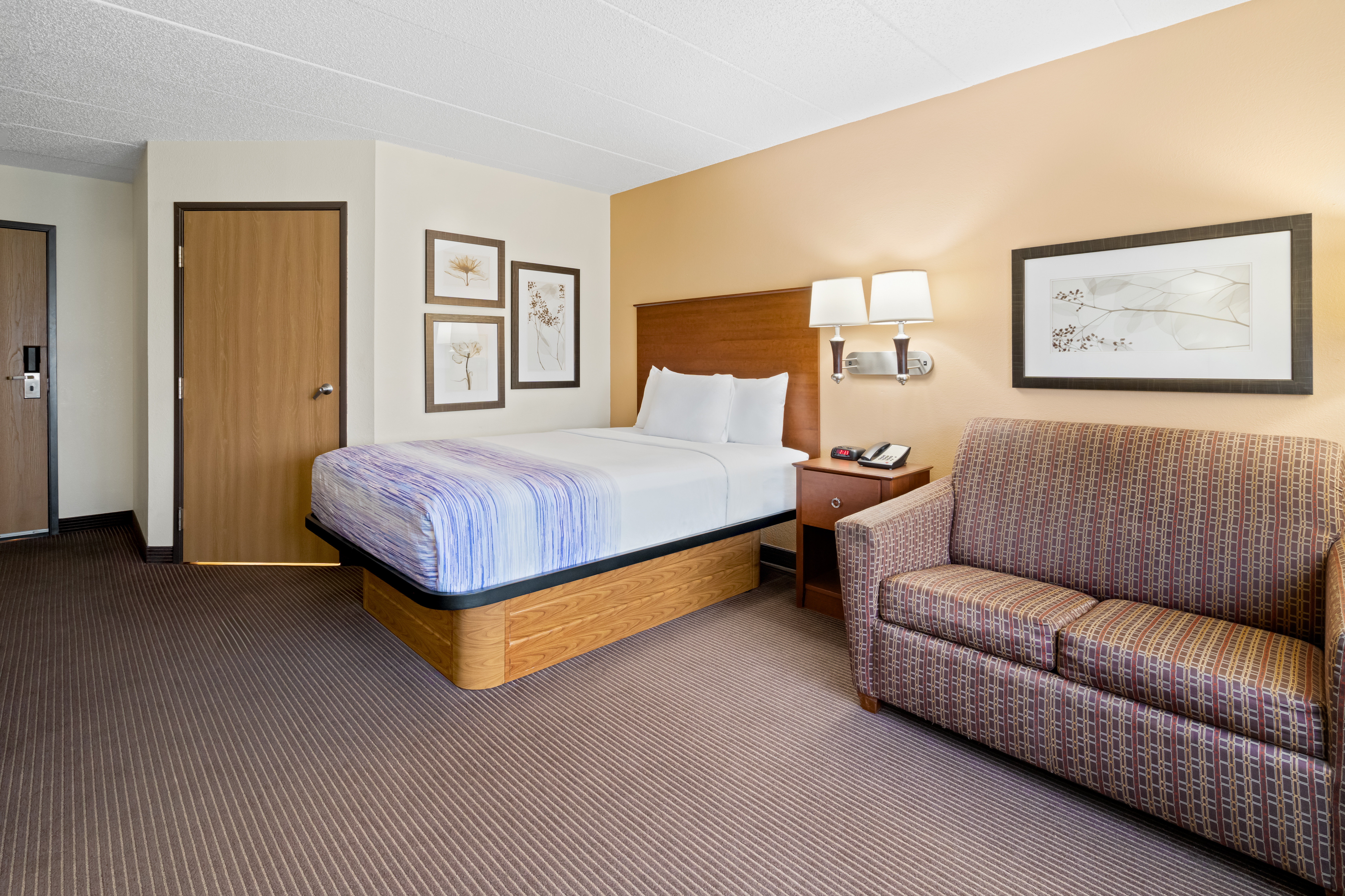 Guest room at the AmericInn by Wyndham Bismarck in Bismarck, North Dakota