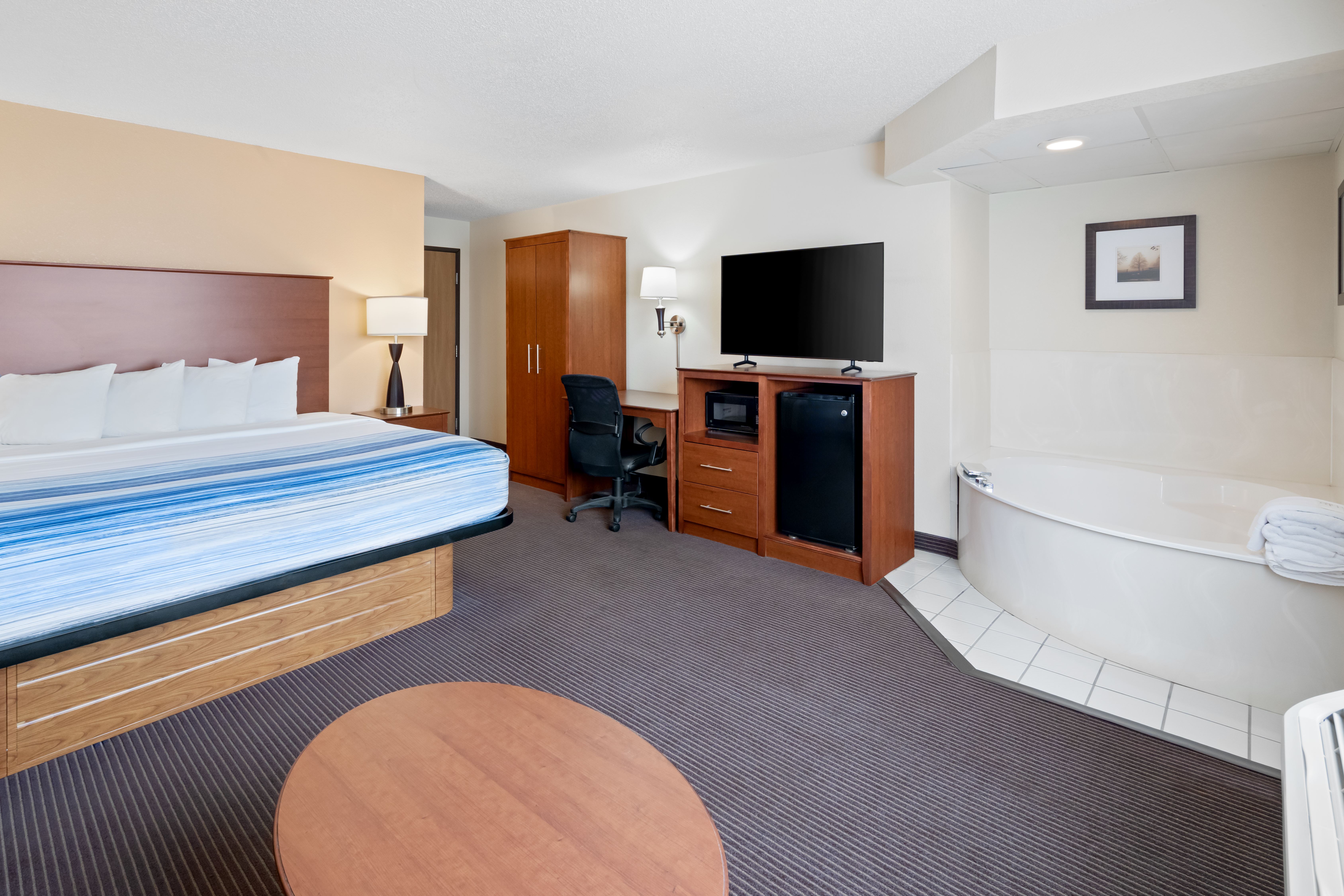 Guest room at the AmericInn by Wyndham Bismarck in Bismarck, North Dakota