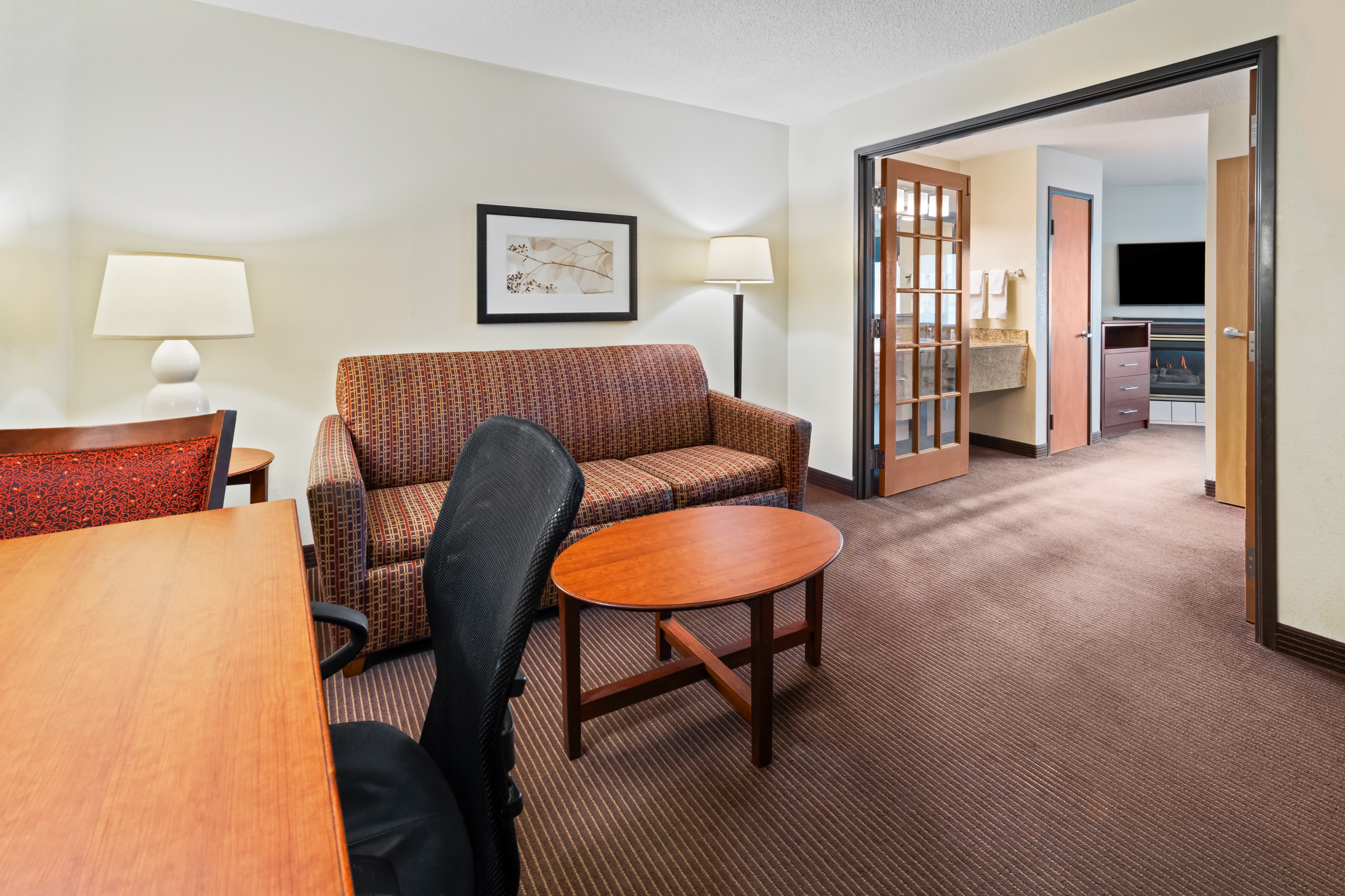 Guest room at the AmericInn by Wyndham Bismarck in Bismarck, North Dakota