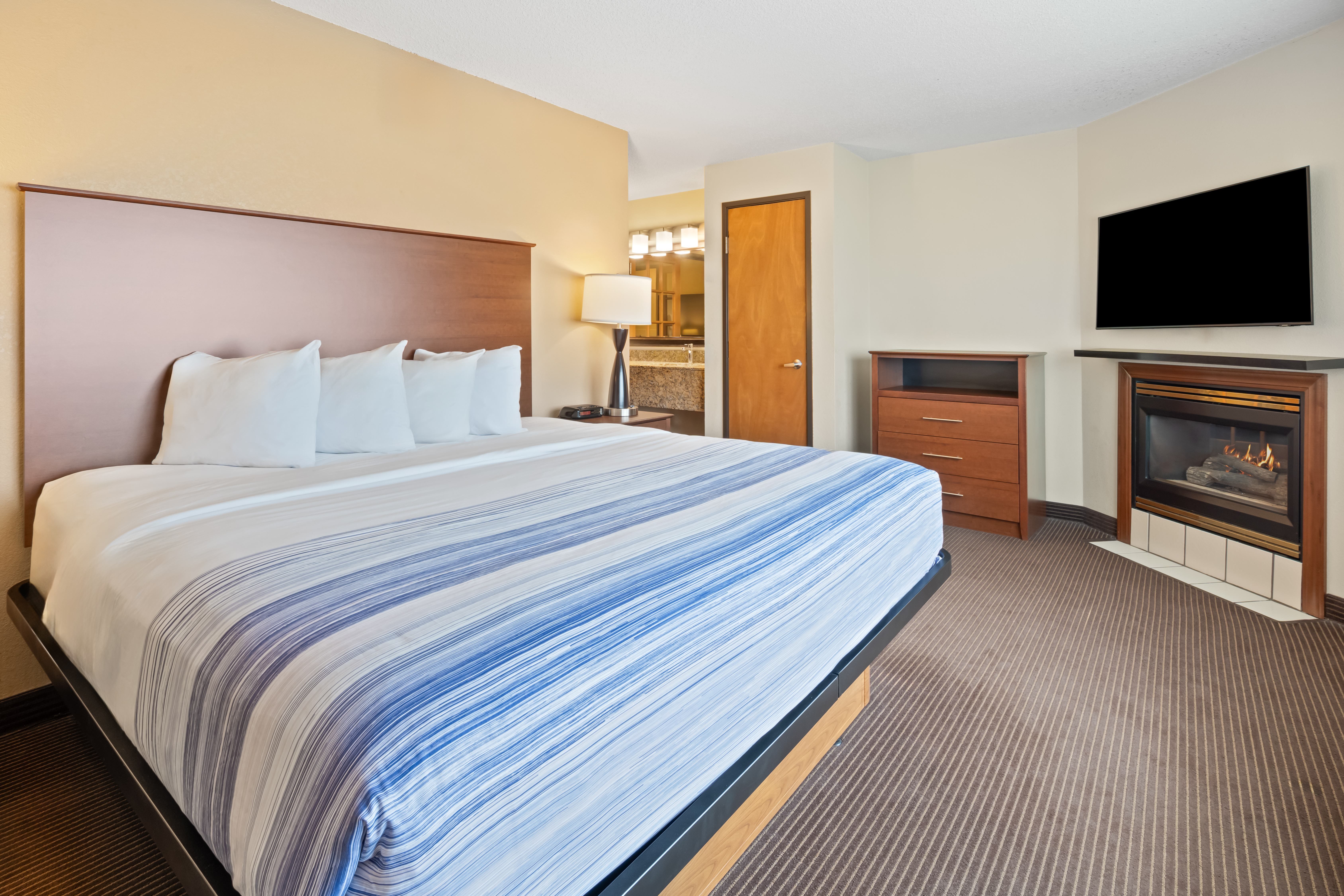 Guest room at the AmericInn by Wyndham Bismarck in Bismarck, North Dakota