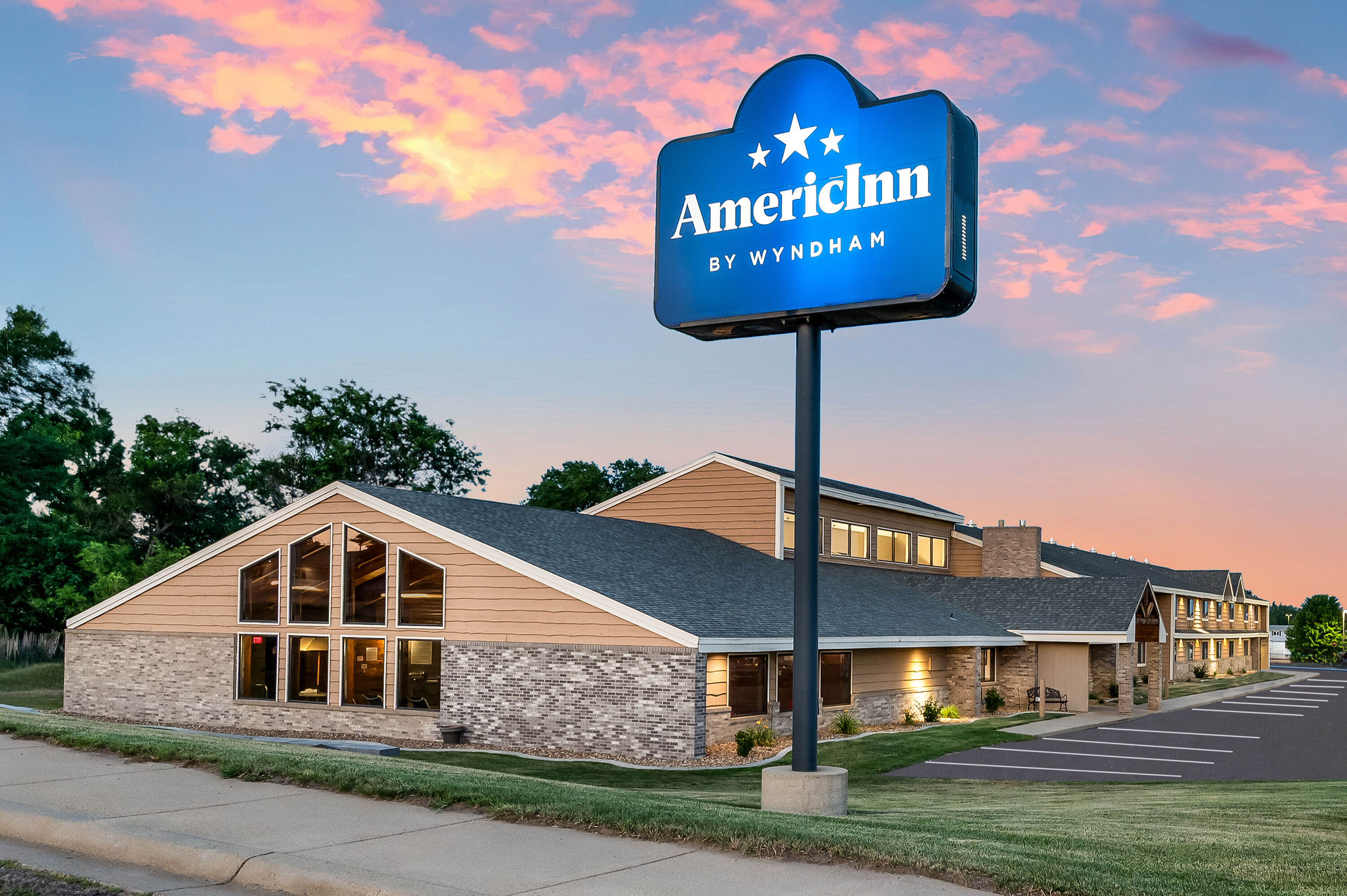 Exterior Dusk Image of AmericInn by Wyndham Dickinson hotel in Dickinson, North Dakota