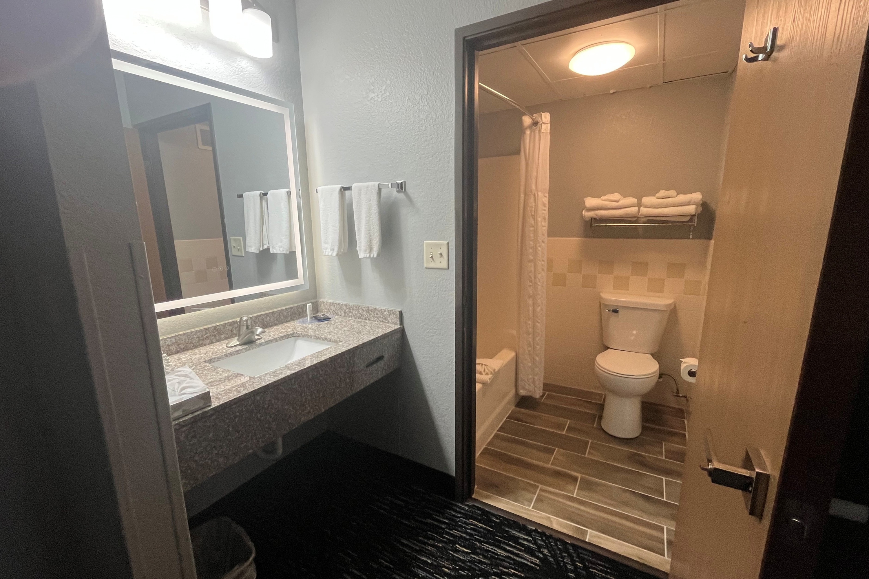 Guest room bath at the AmericInn by Wyndham Lincoln North in Lincoln, Nebraska