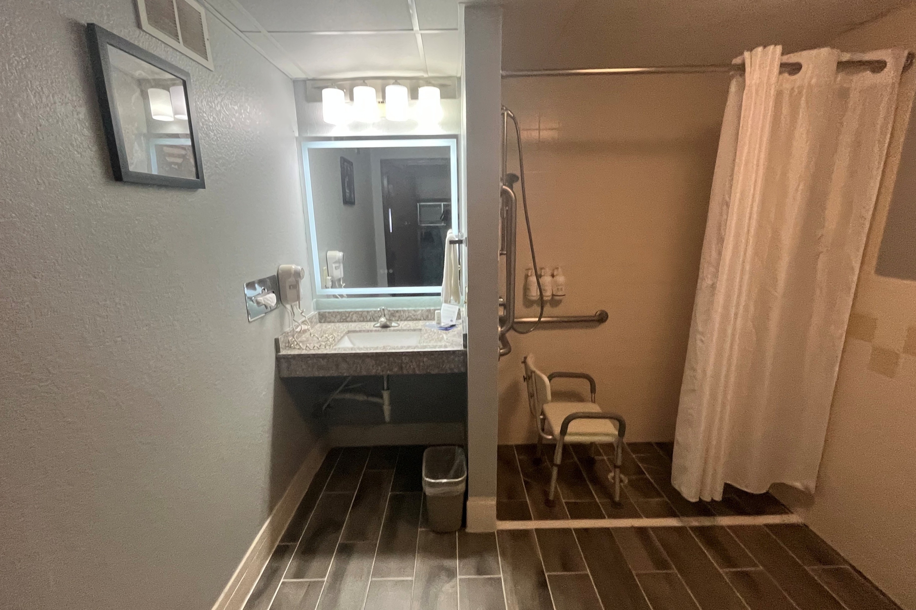 Guest room bath at the AmericInn by Wyndham Lincoln North in Lincoln, Nebraska