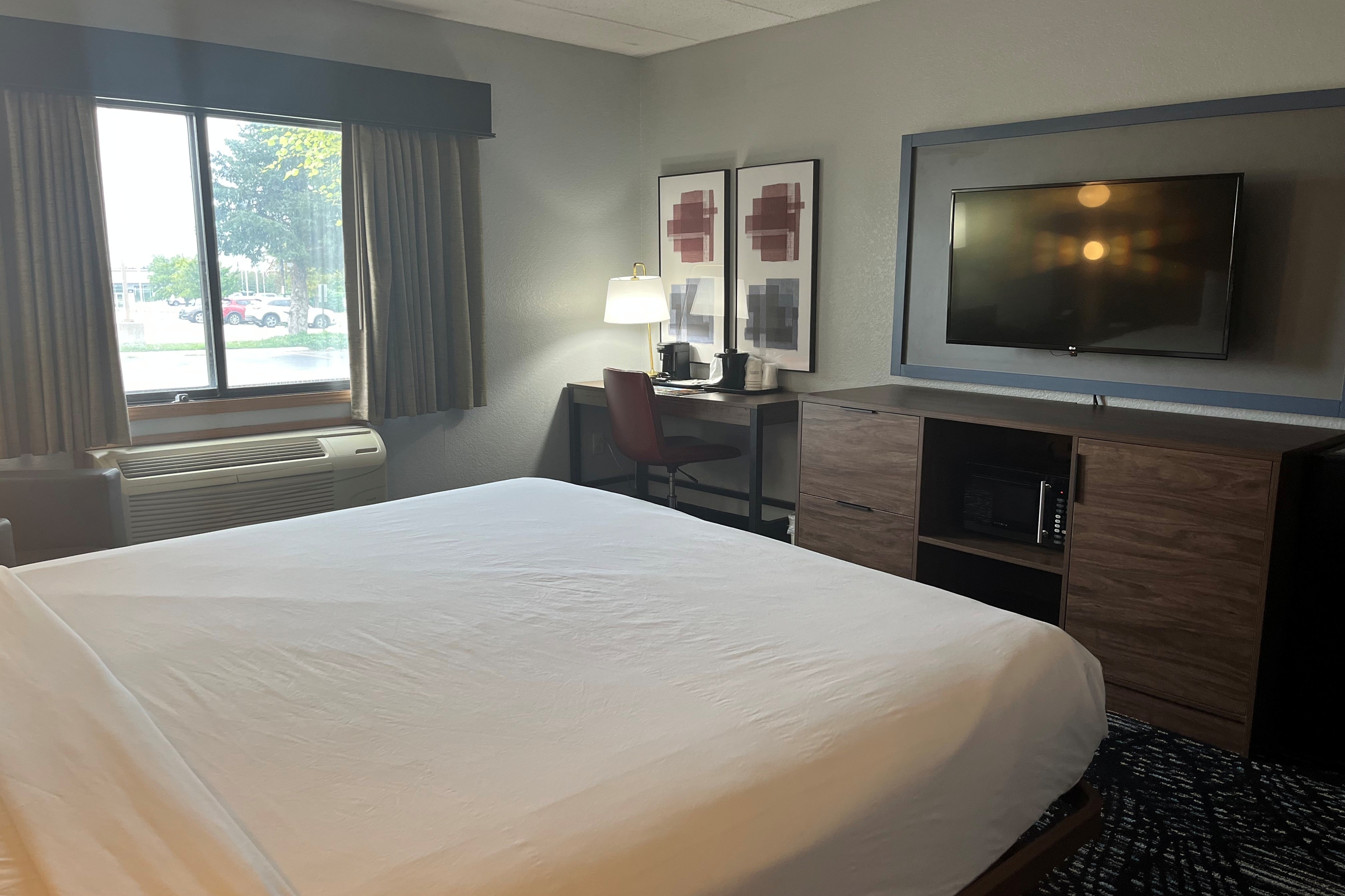 Guest room at the AmericInn by Wyndham Lincoln North in Lincoln, Nebraska