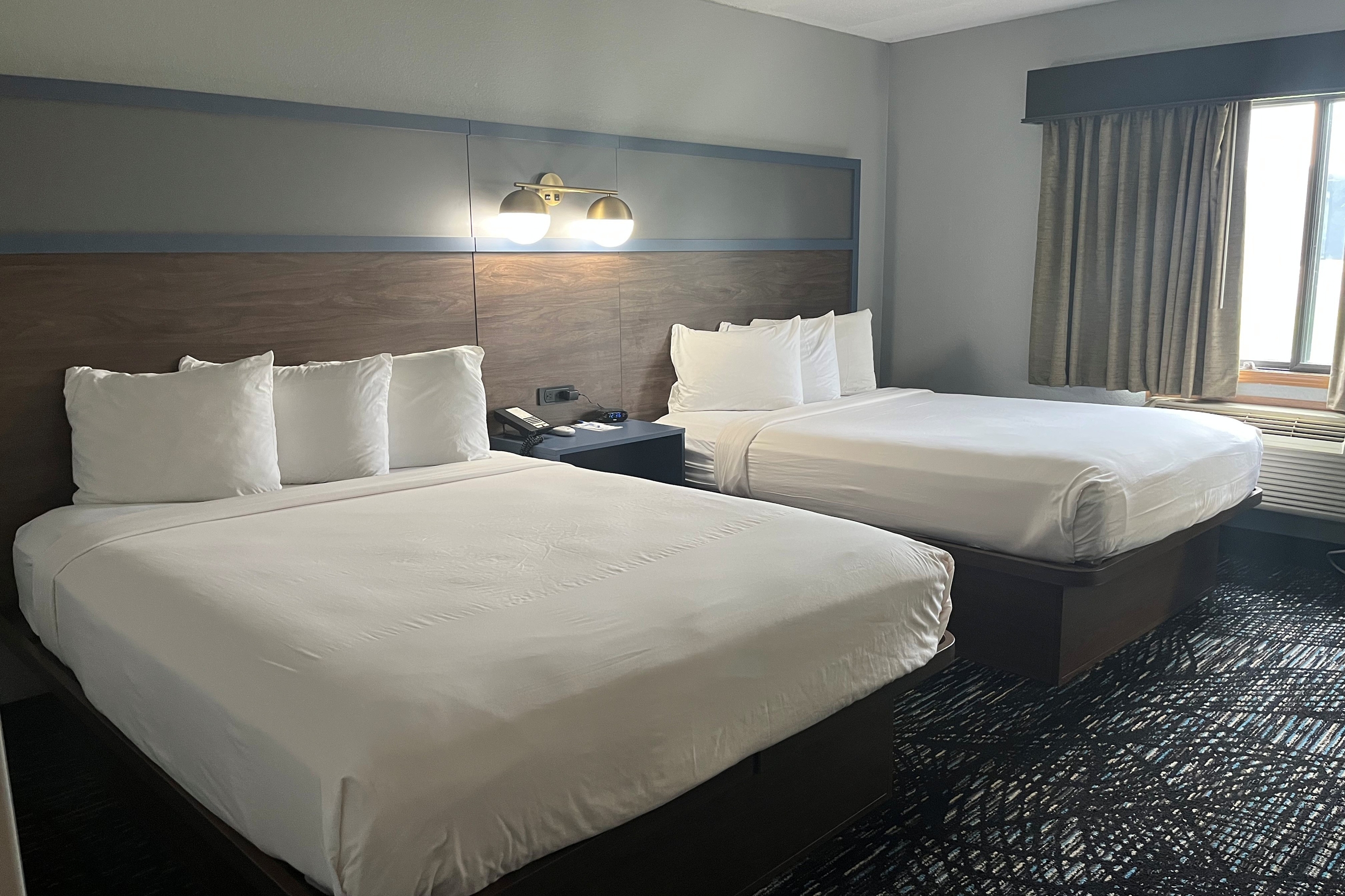 Guest room at the AmericInn by Wyndham Lincoln North in Lincoln, Nebraska