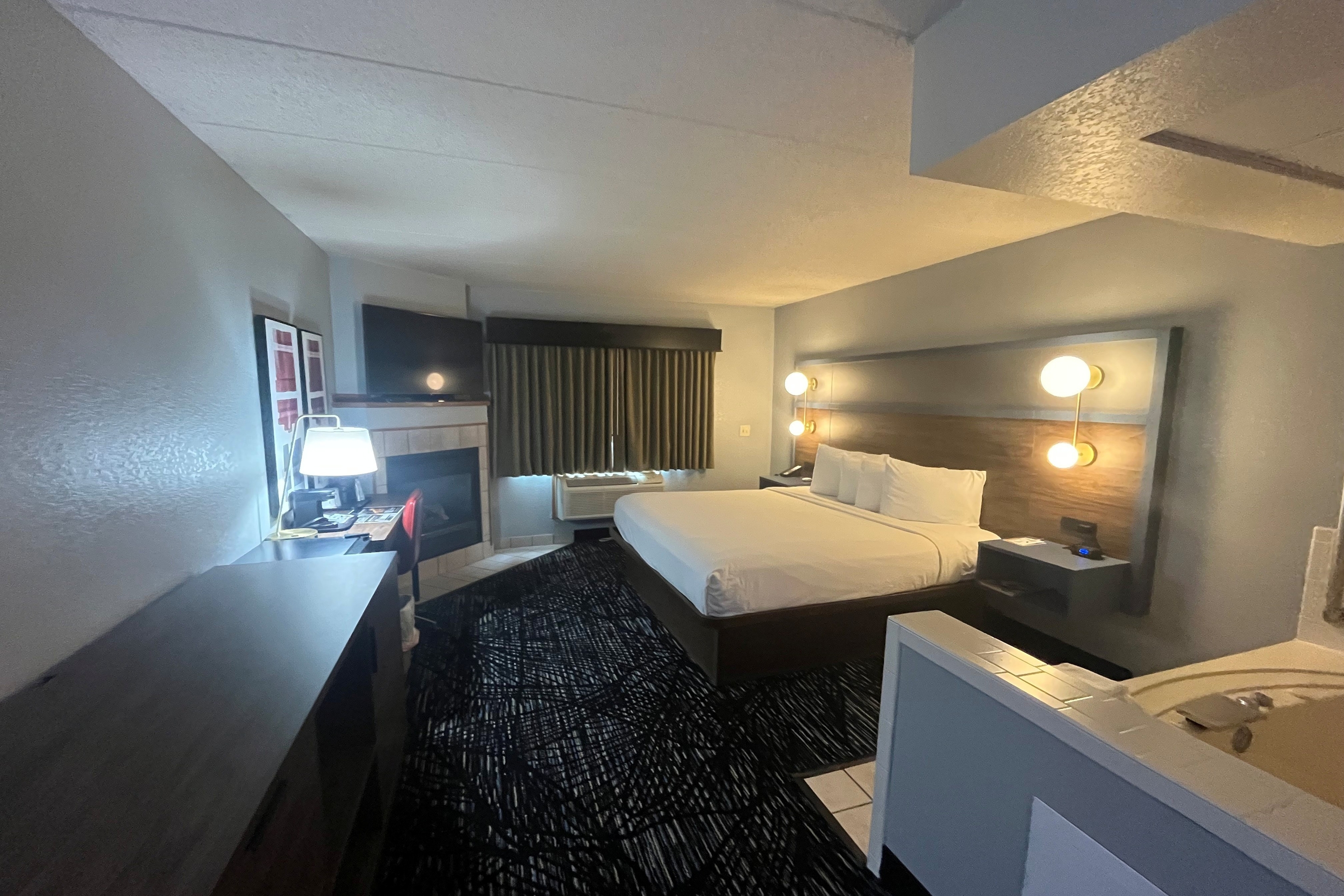 Guest room at the AmericInn by Wyndham Lincoln North in Lincoln, Nebraska