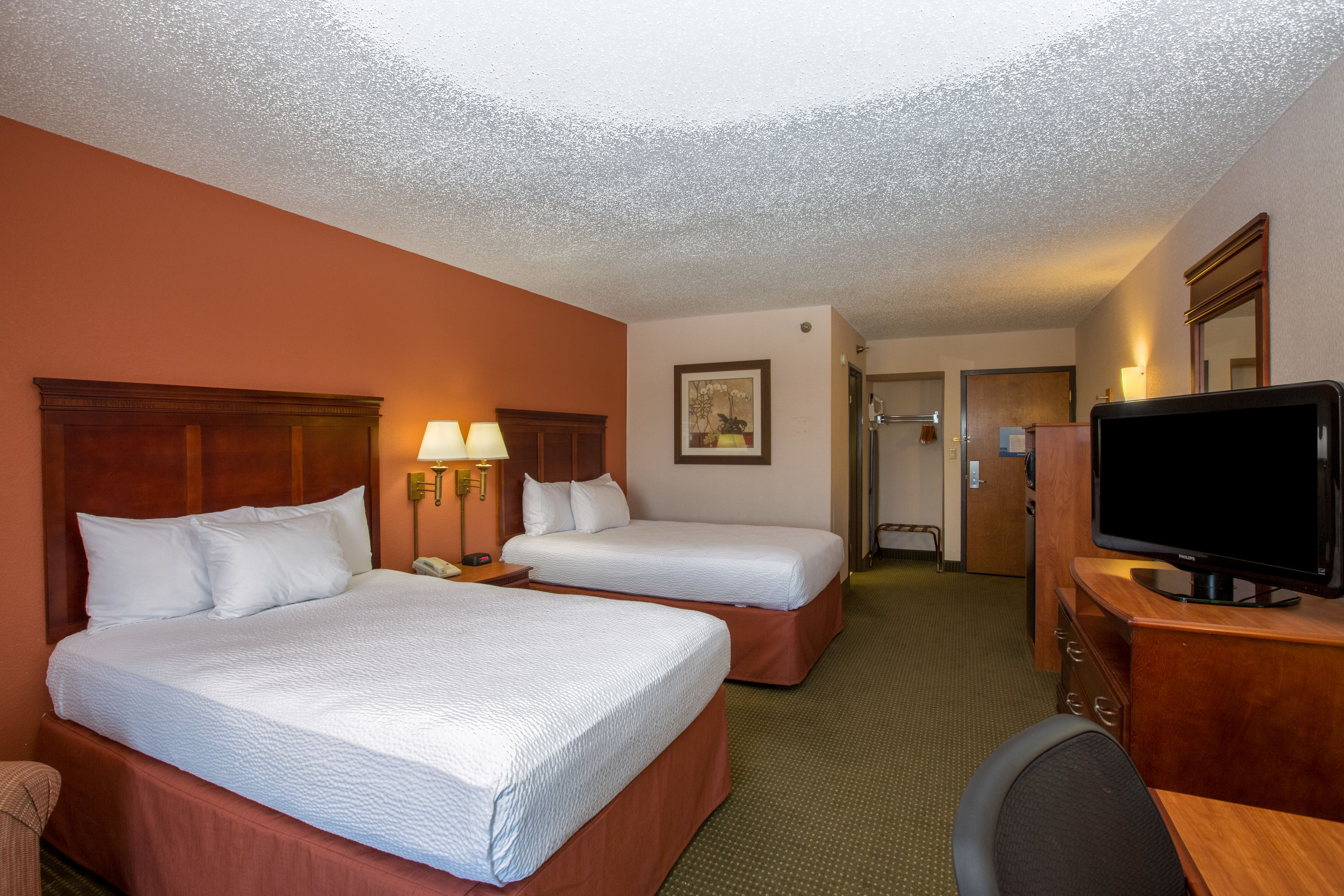 Guest room at the AmericInn by Wyndham Omaha in Omaha, Nebraska
