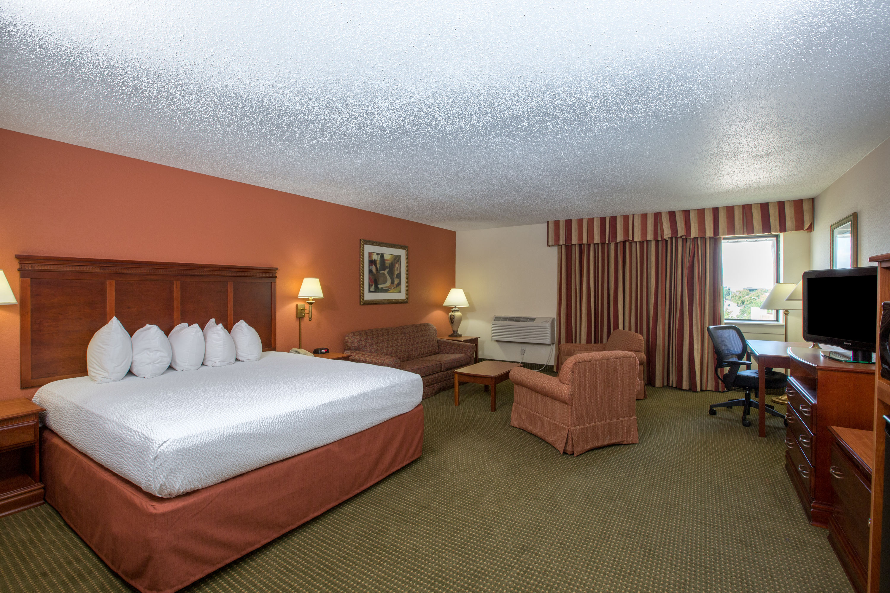Guest room at the AmericInn by Wyndham Omaha in Omaha, Nebraska