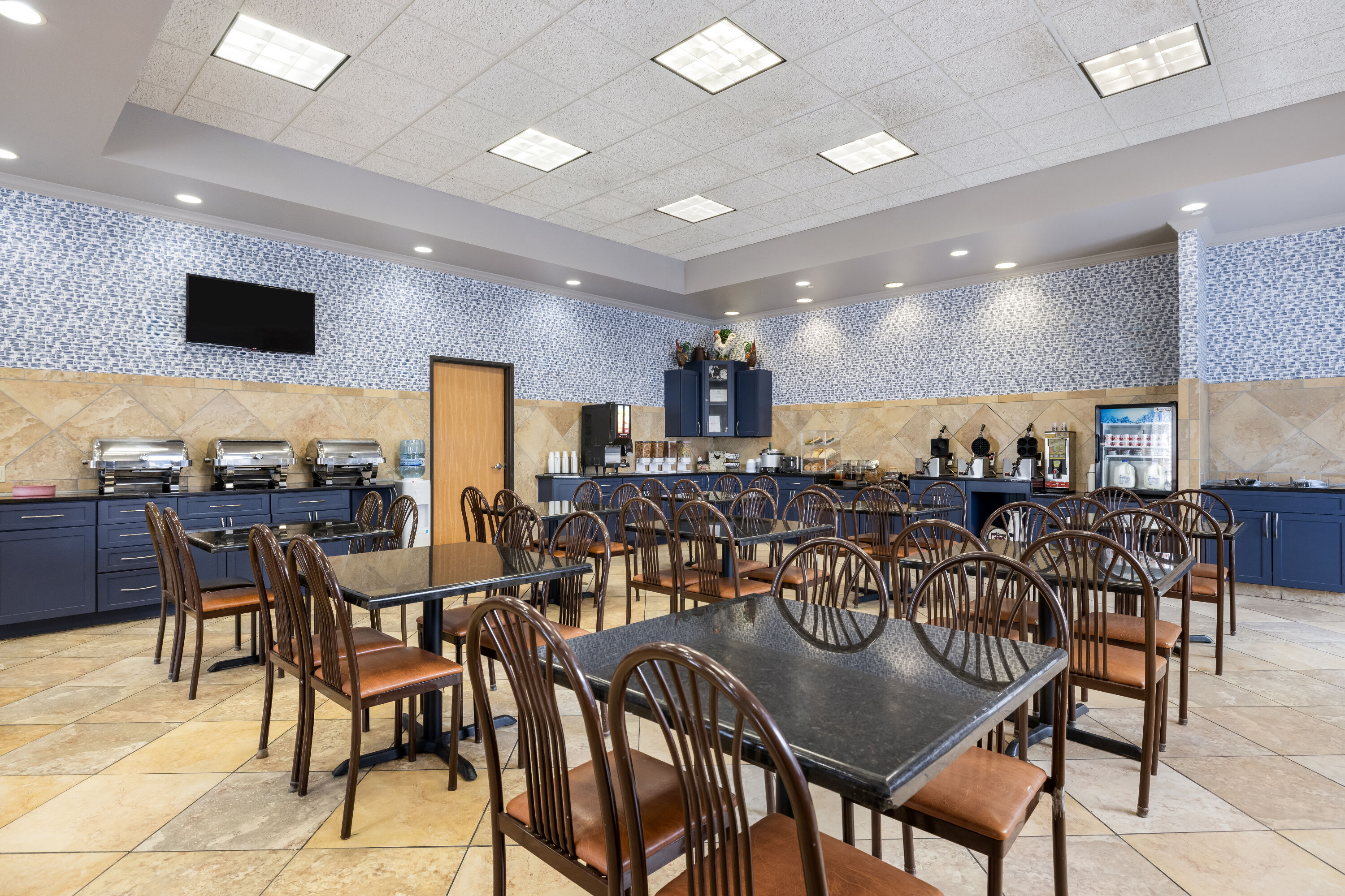 AmericInn by Wyndham Aberdeen Event Center restaurant breakfast area with seating in Aberdeen, South Dakota
