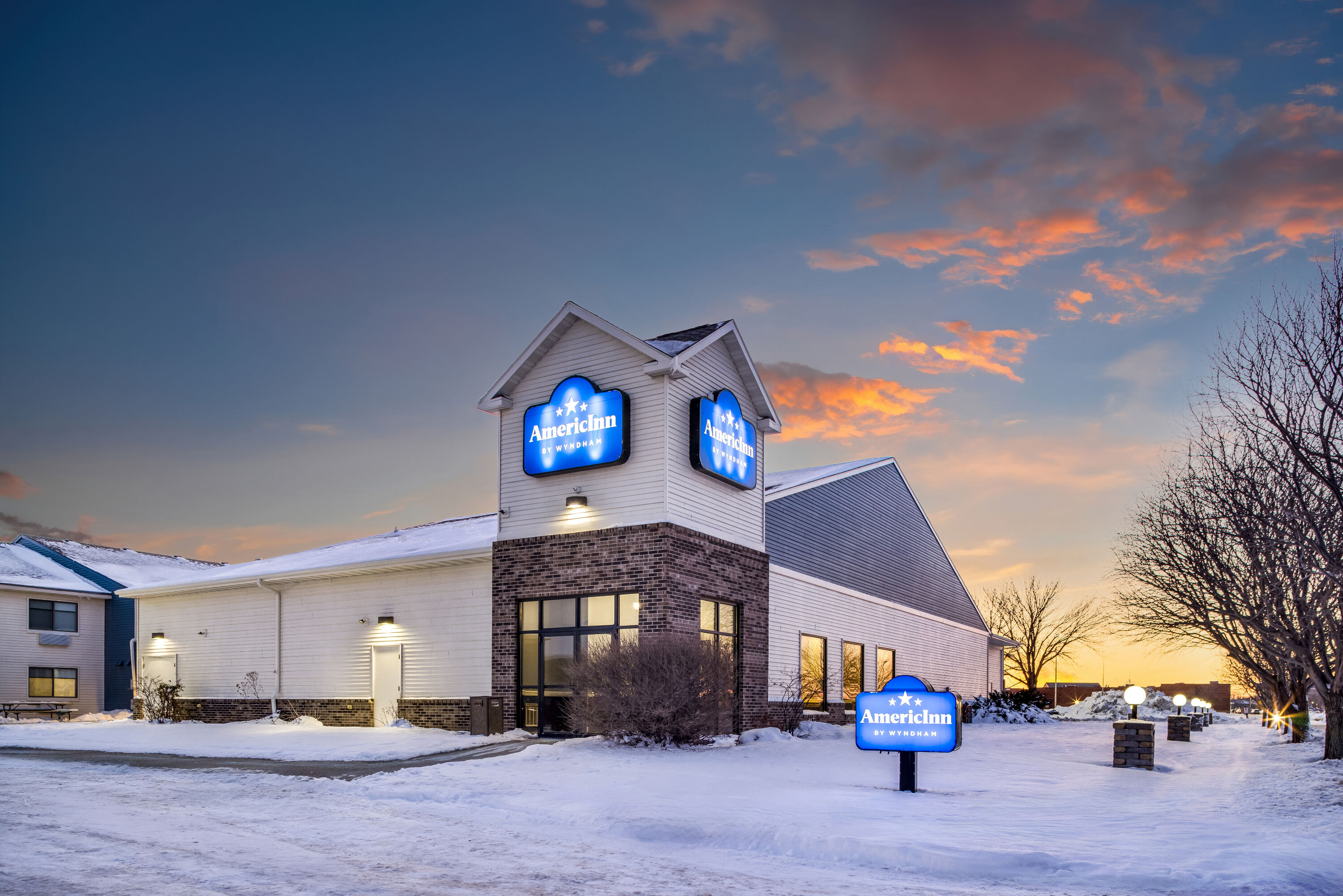 Exterior Dusk Image of AmericInn by Wyndham Aberdeen Event Center hotel in Aberdeen, South Dakota