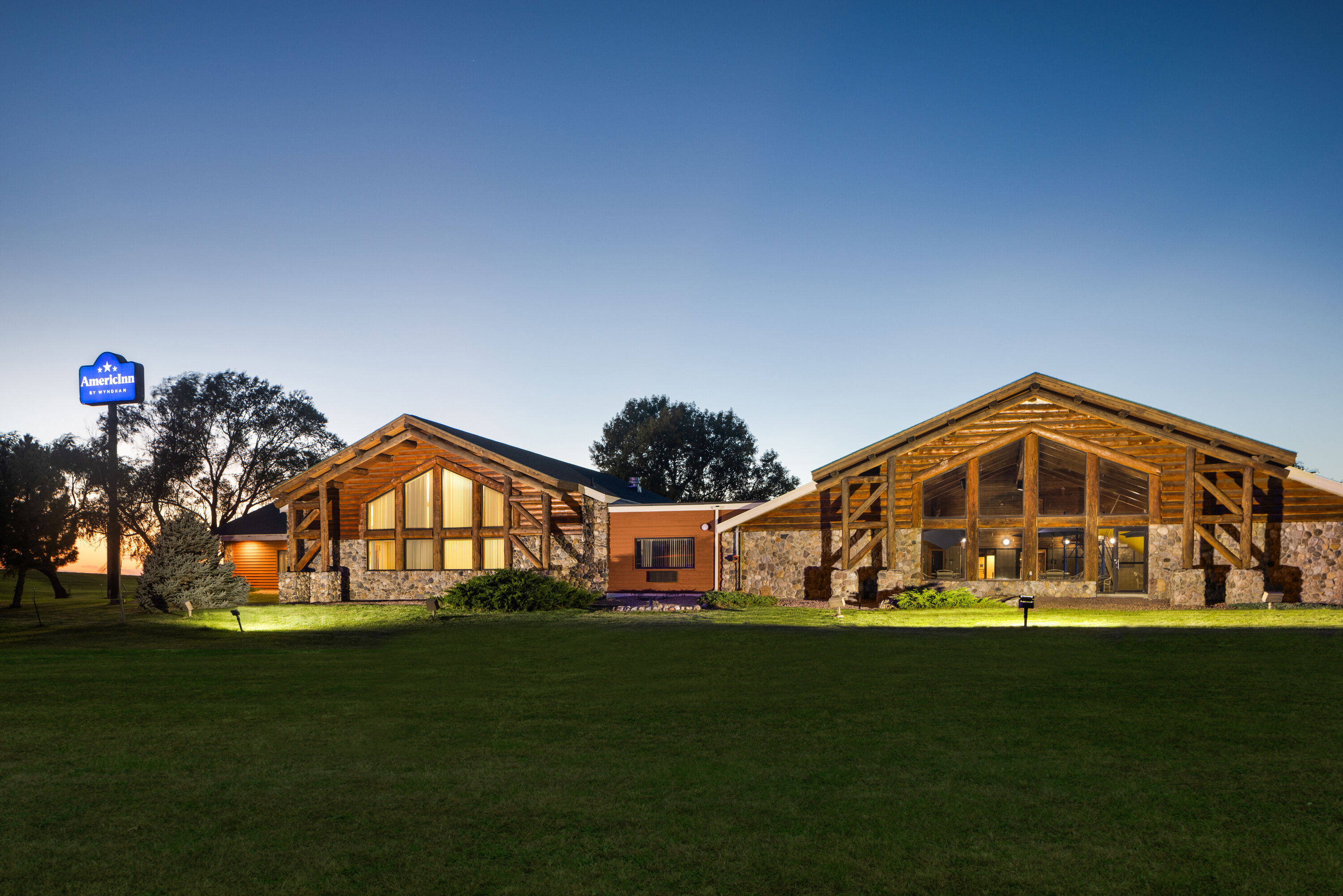 Exterior Dusk Image of AmericInn by Wyndham Chamberlain Conference Center hotel in Chamberlain, South Dakota