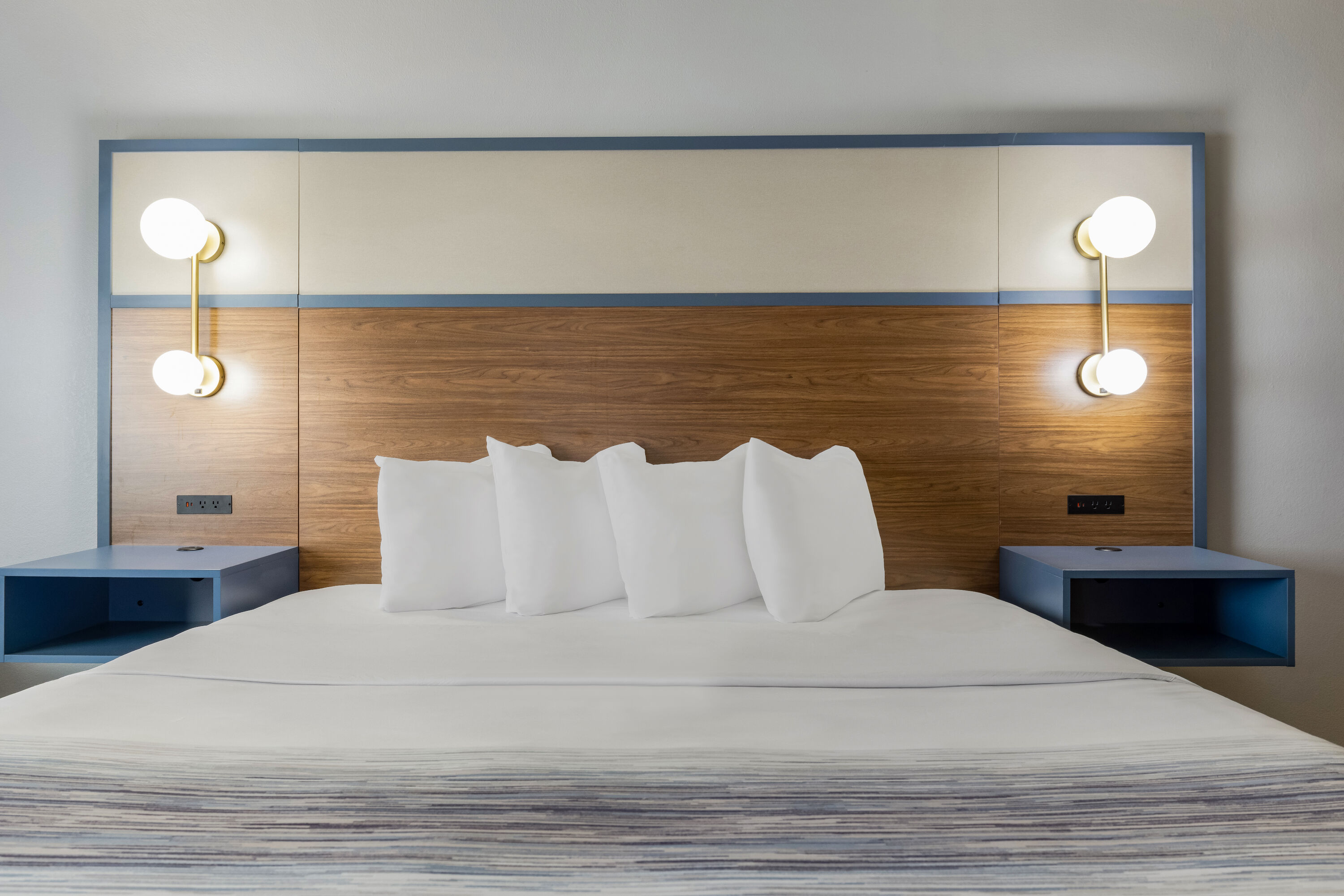 King bed guest room at the AmericInn by Wyndham Chamberlain Conference Center in Chamberlain, South Dakota