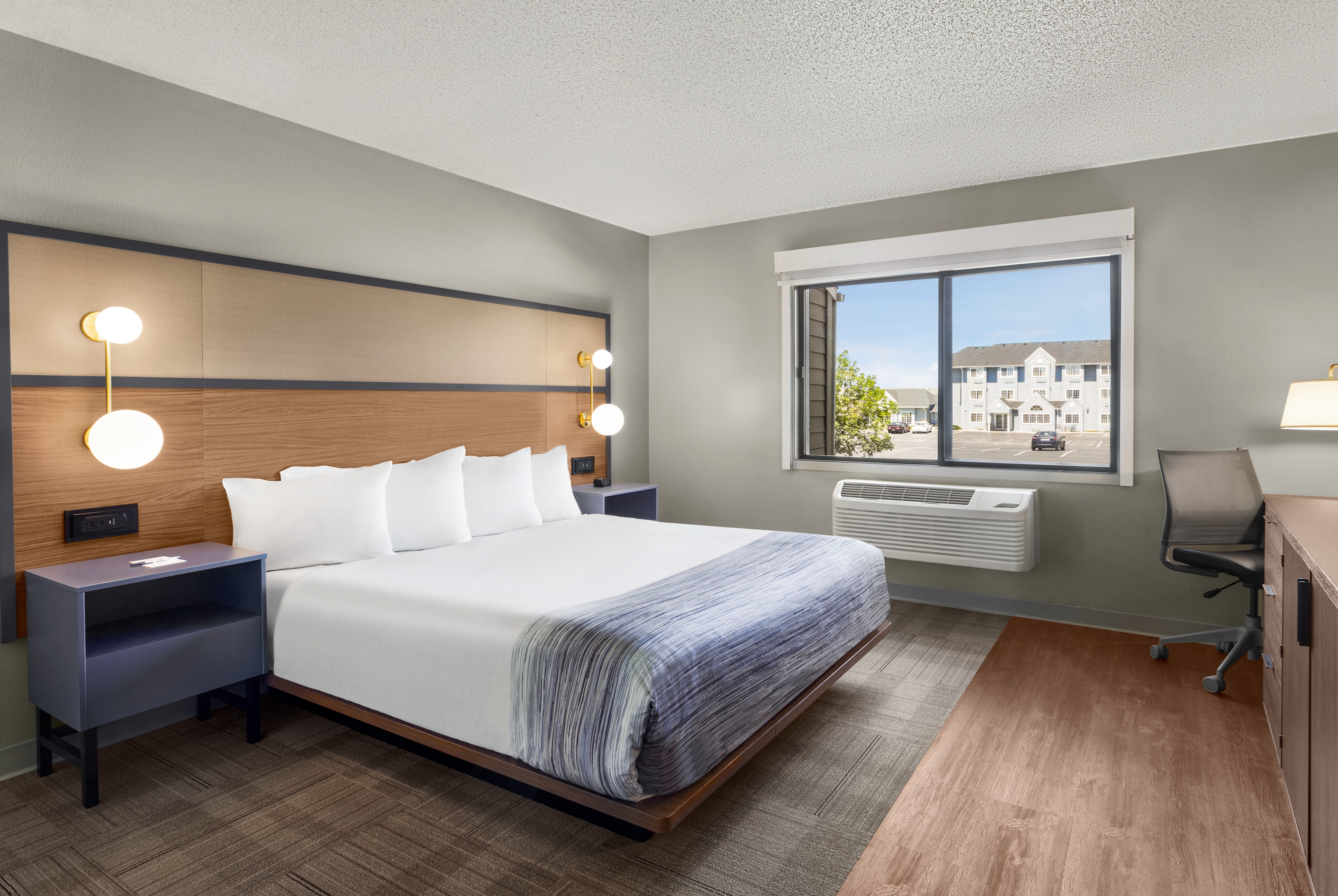 Guest room at the AmericInn by Wyndham Rapid City in Rapid City, South Dakota