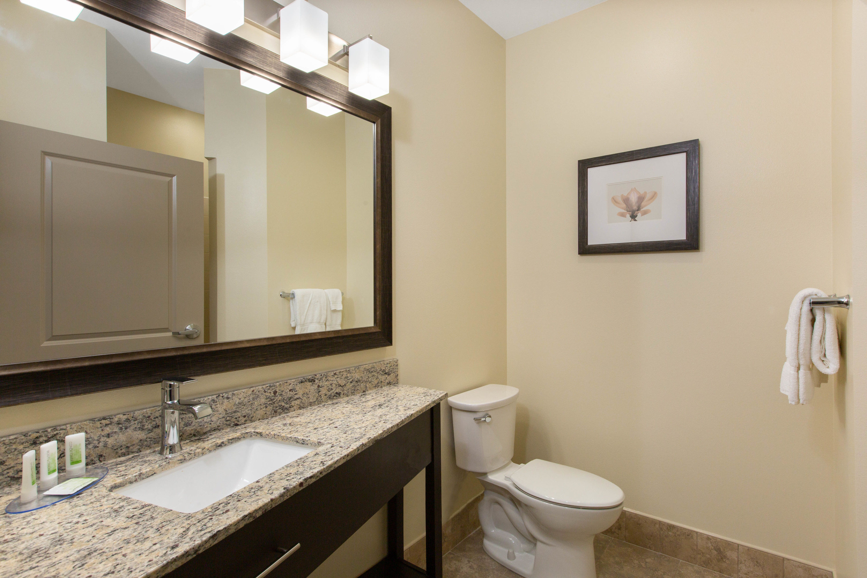 Guest room bath at the AmericInn by Wyndham Sioux Falls North in Sioux Falls, South Dakota