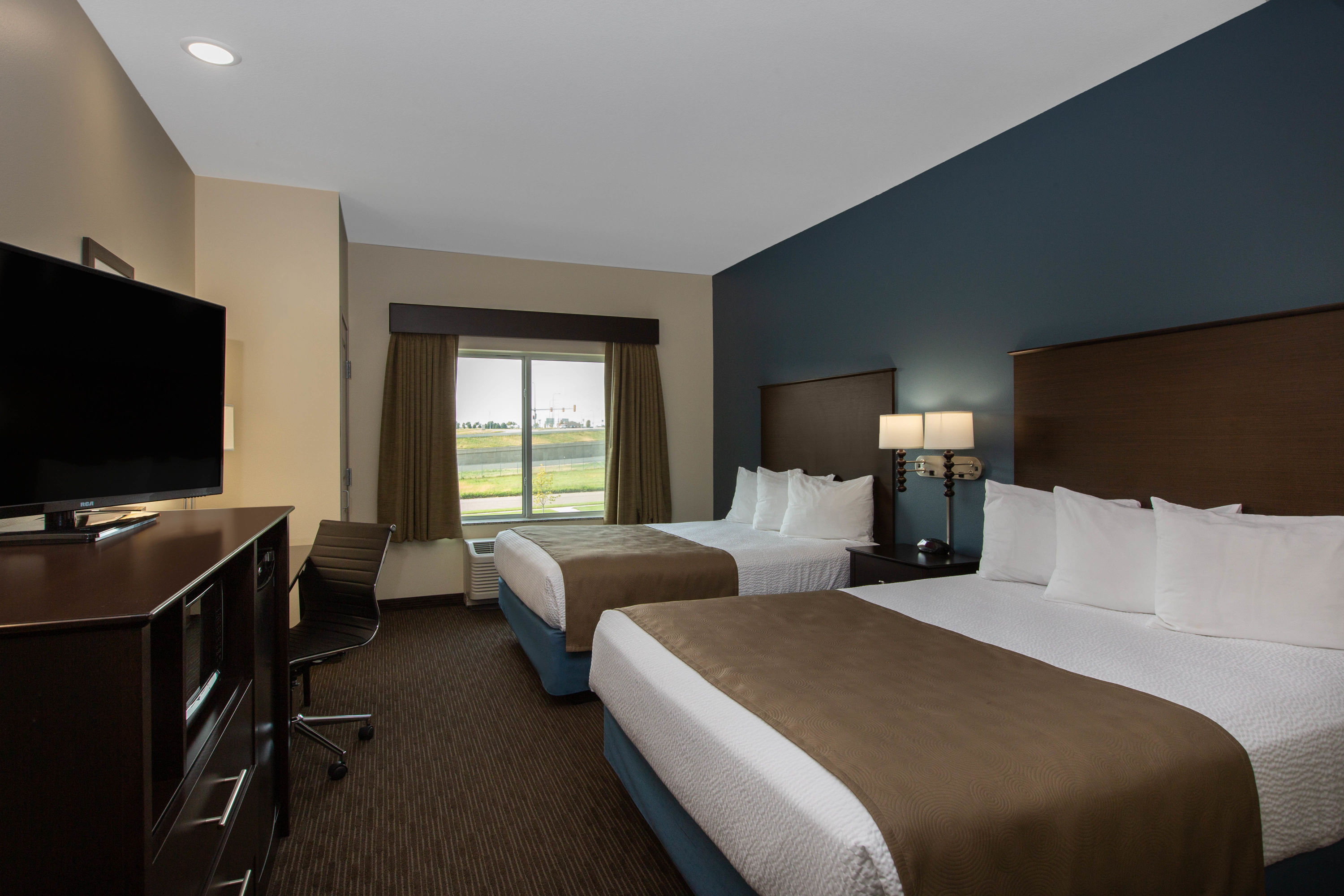 Guest room at the AmericInn by Wyndham Sioux Falls North in Sioux Falls, South Dakota