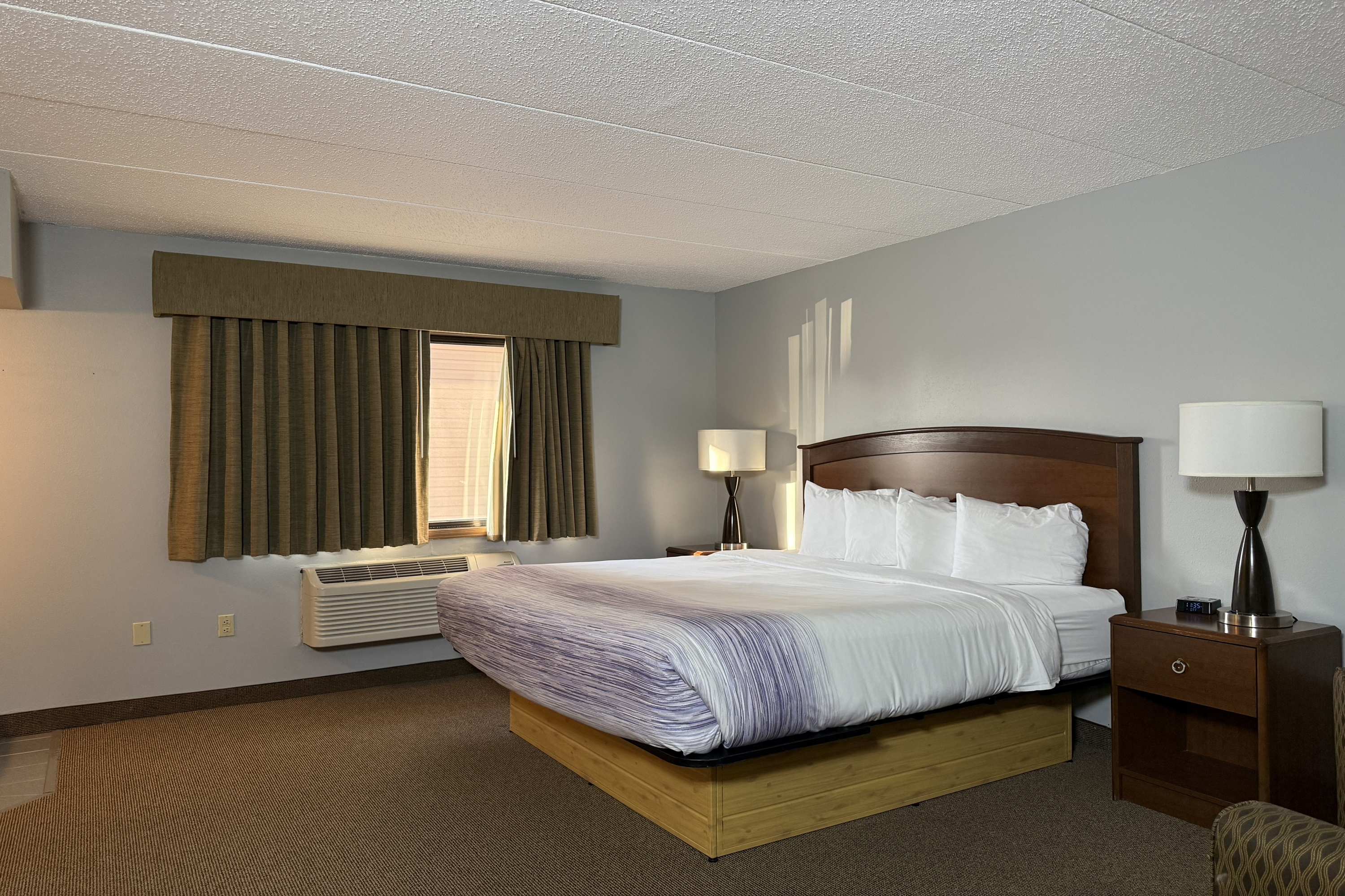Guest room at the AmericInn by Wyndham Sioux Falls in Sioux Falls, South Dakota