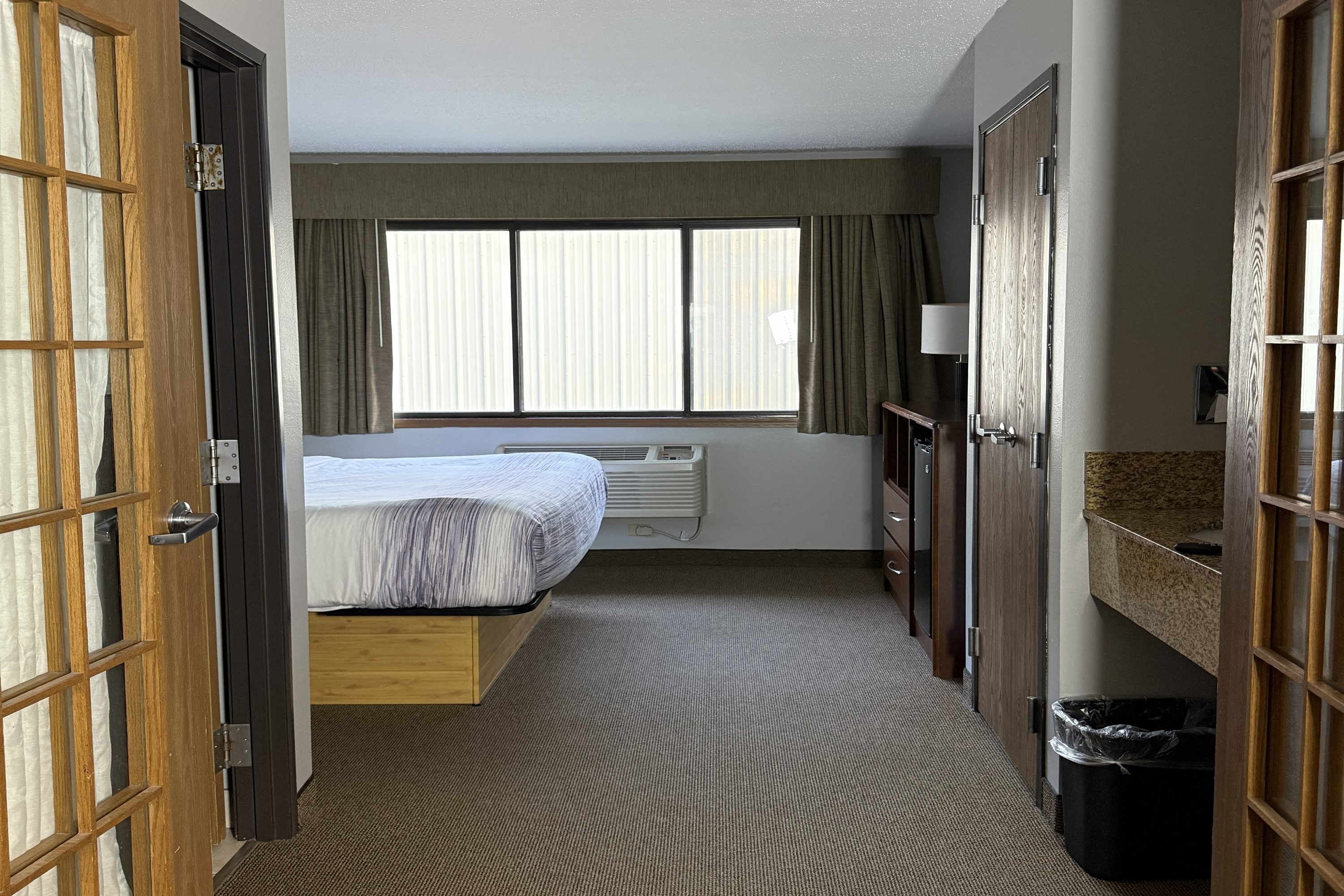 Guest room at the AmericInn by Wyndham Sioux Falls in Sioux Falls, South Dakota