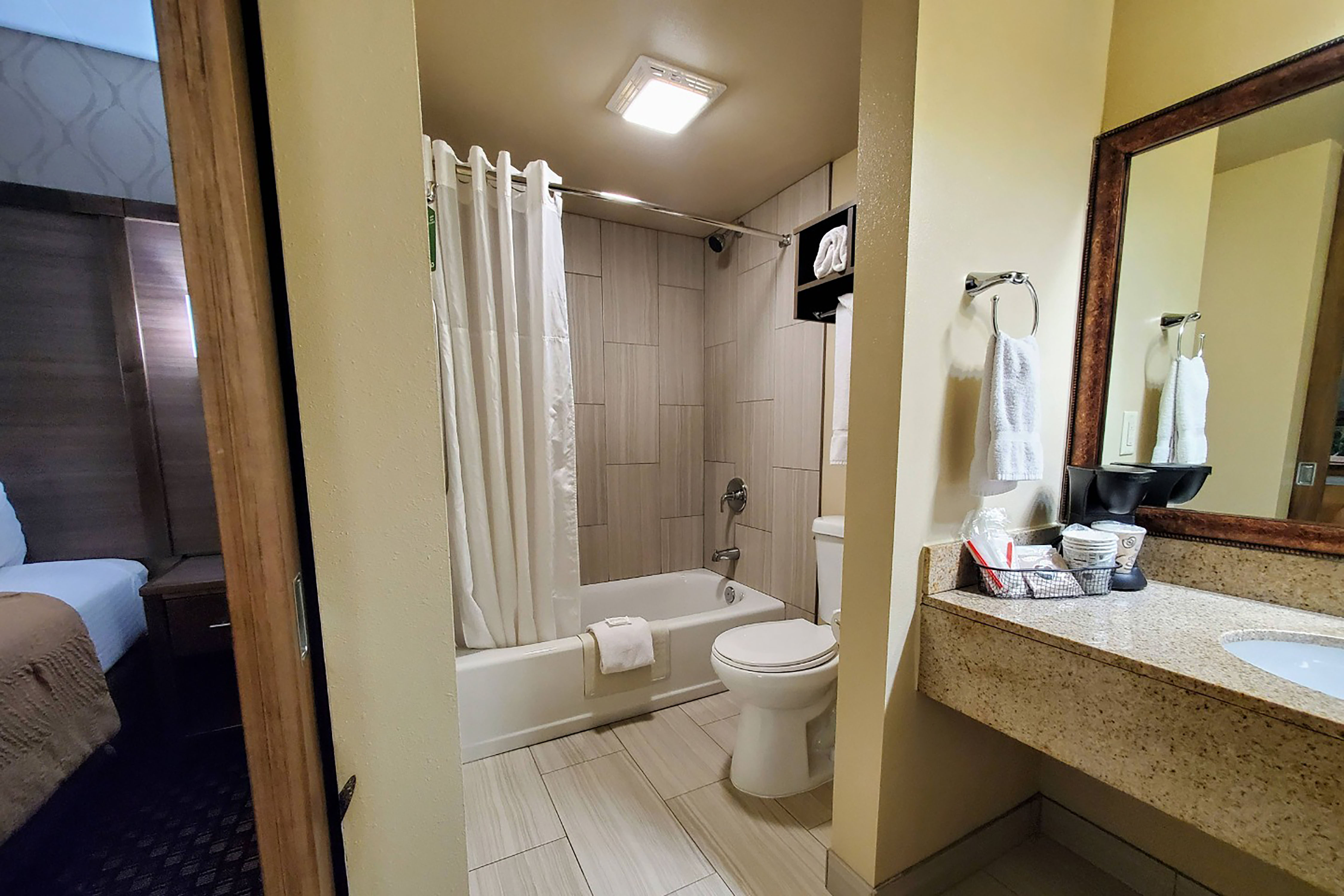 Guest room bath at the AmericInn by Wyndham Watertown in Watertown, South Dakota