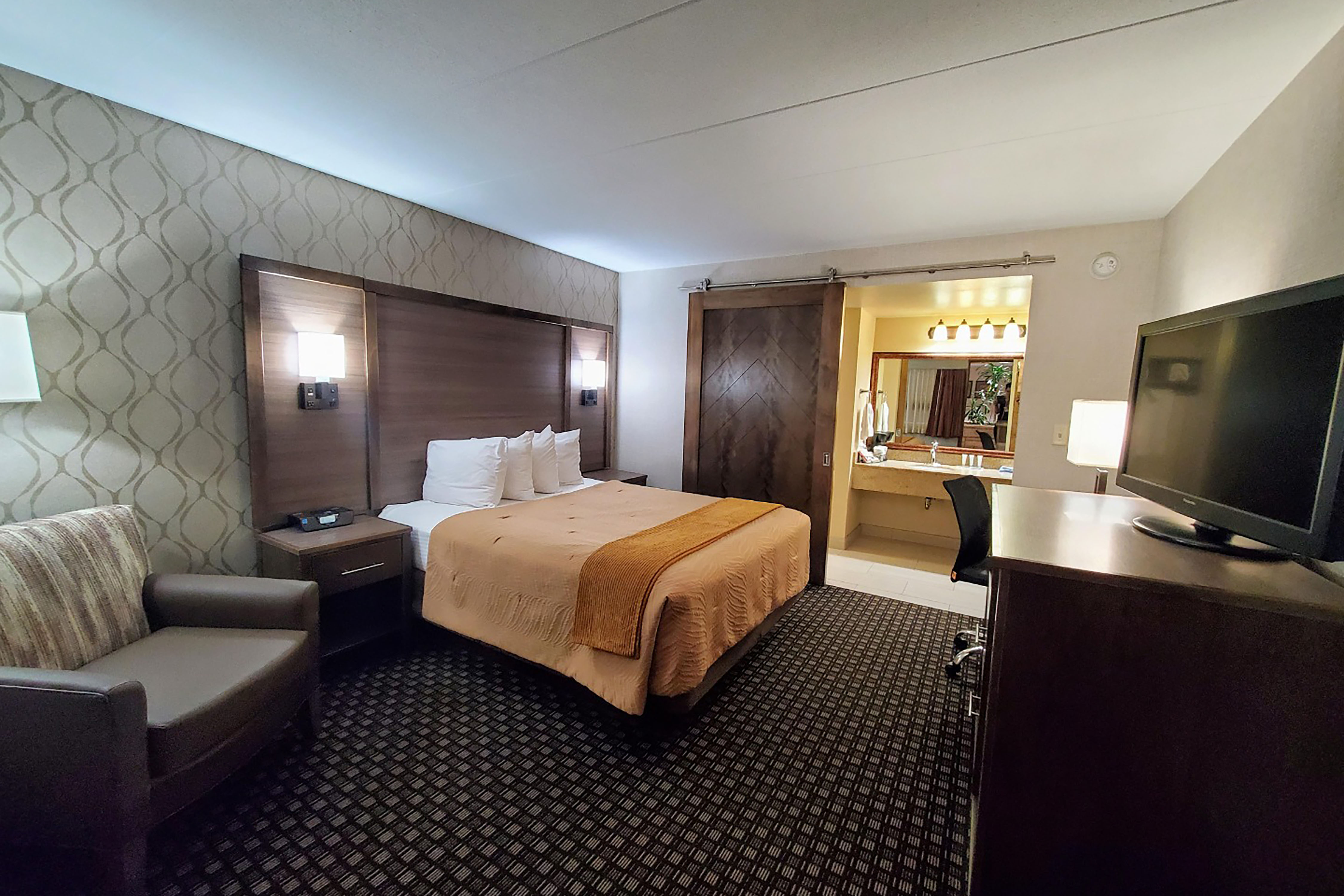 Guest room at the AmericInn by Wyndham Watertown in Watertown, South Dakota