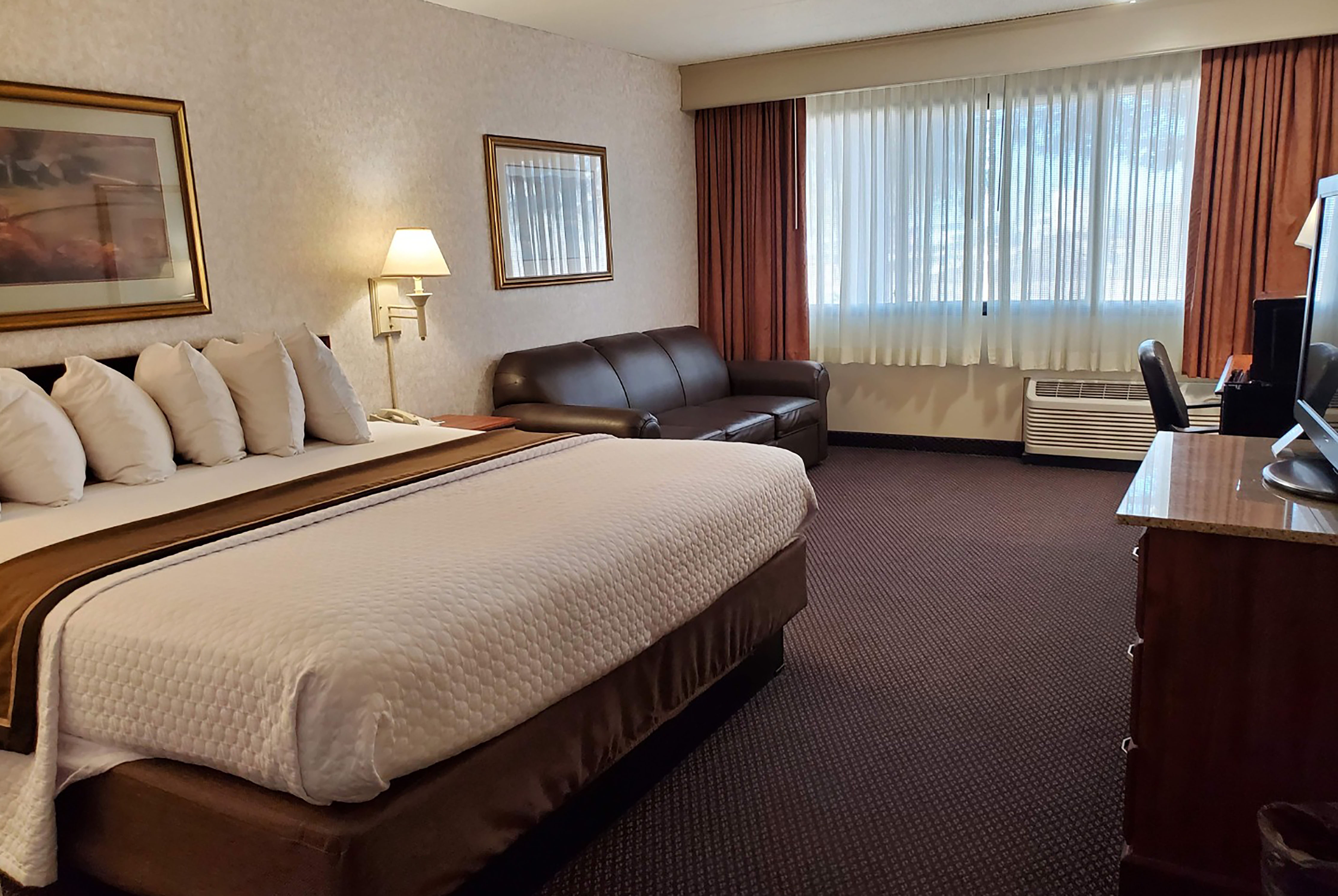 Guest room at the AmericInn by Wyndham Watertown in Watertown, South Dakota