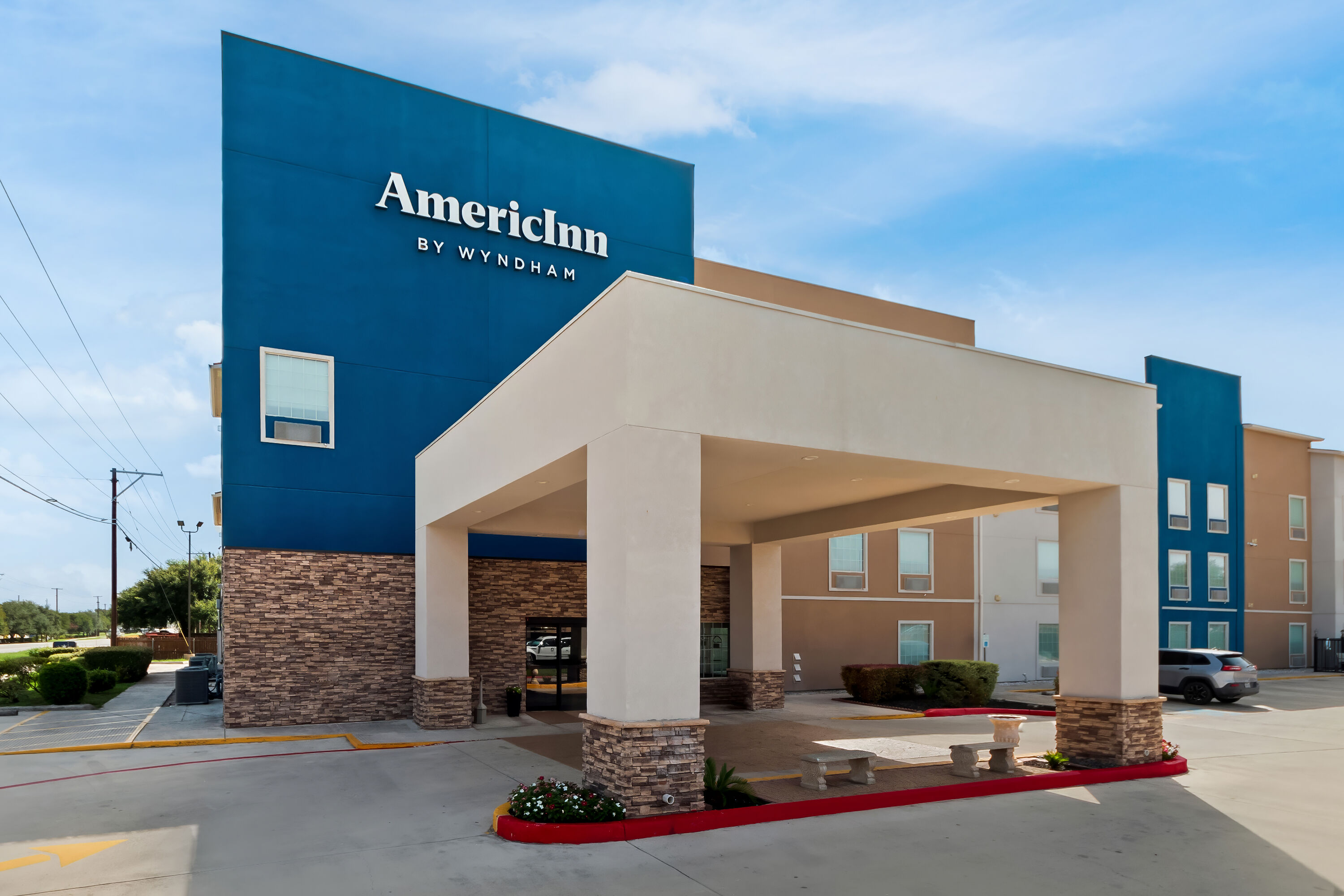 Exterior of AmericInn by Wyndham New Braunfels hotel in New Braunfels, Texas