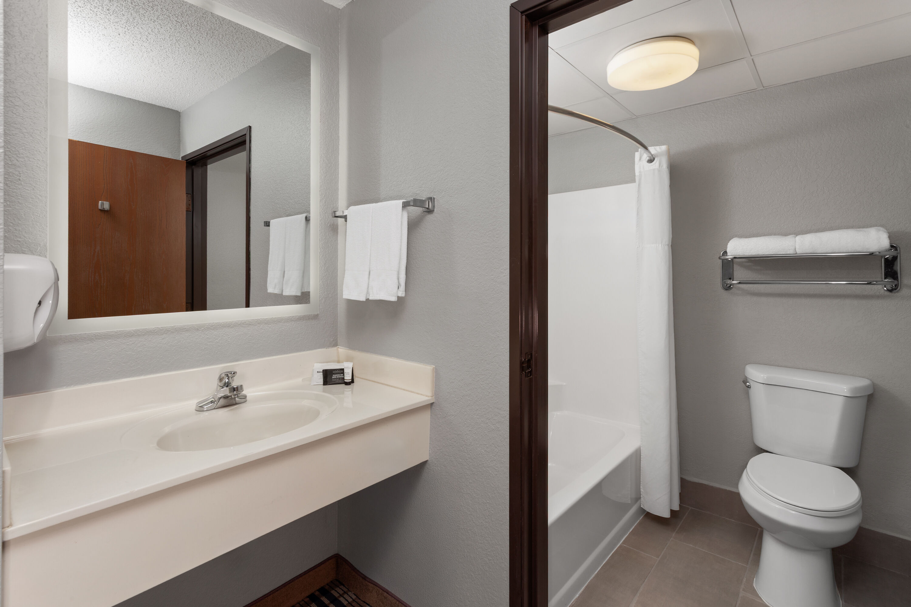 Guest room bath at the AmericInn by Wyndham Appleton North/Little Chute in Appleton, Wisconsin
