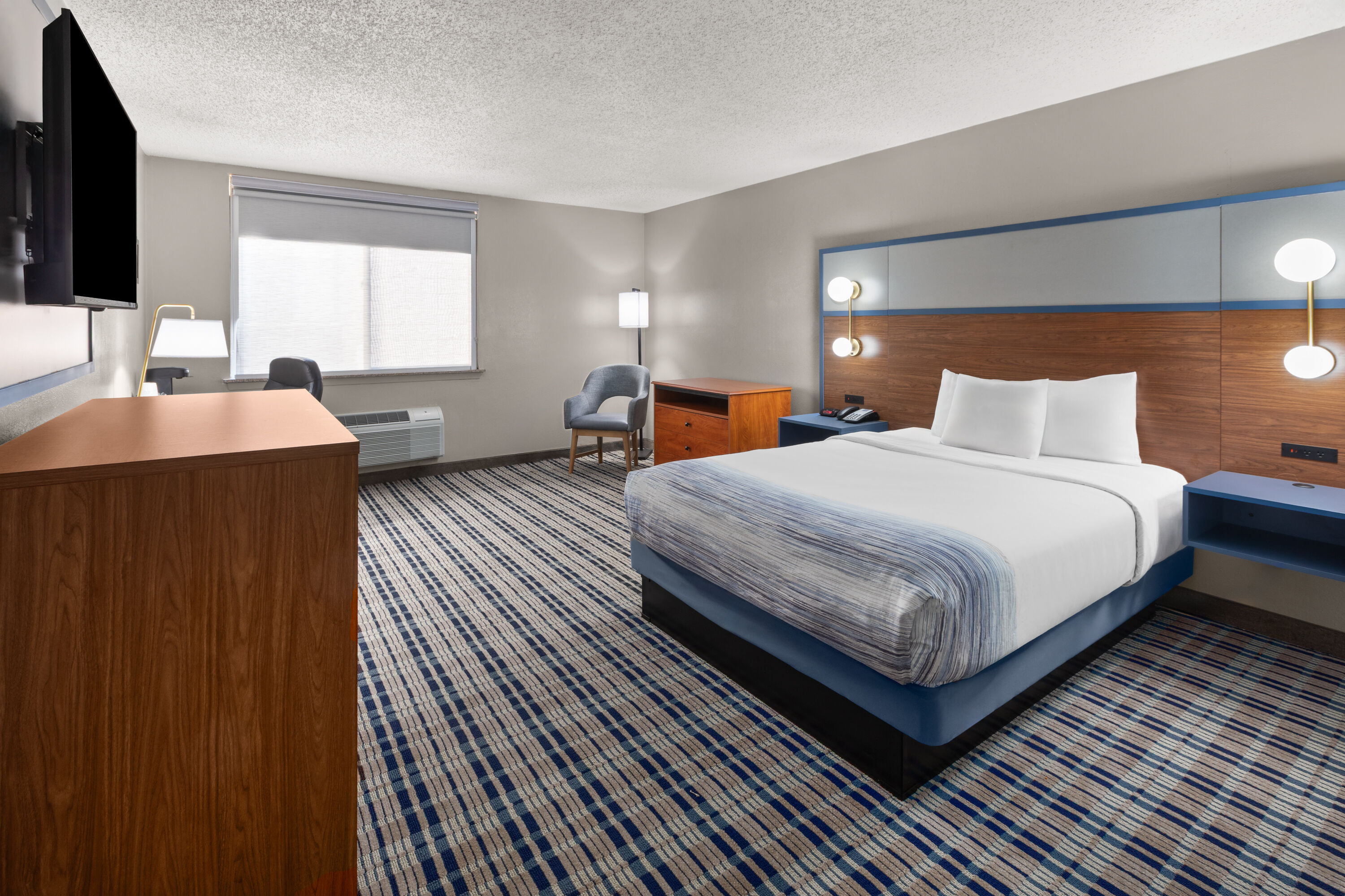 Guest room at the AmericInn by Wyndham Appleton Downtown in Appleton, Wisconsin