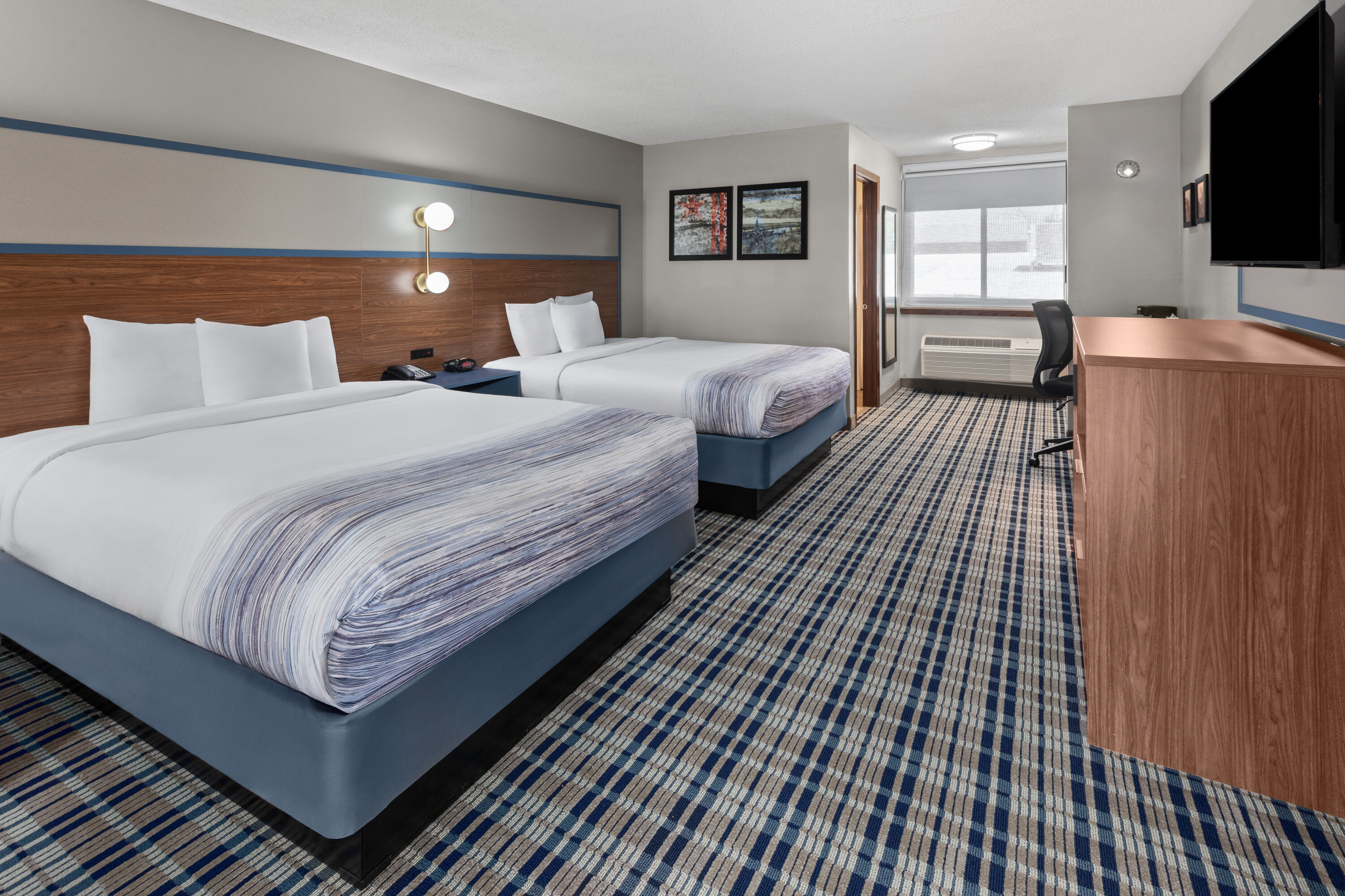 Guest room at the AmericInn by Wyndham Appleton Downtown in Appleton, Wisconsin