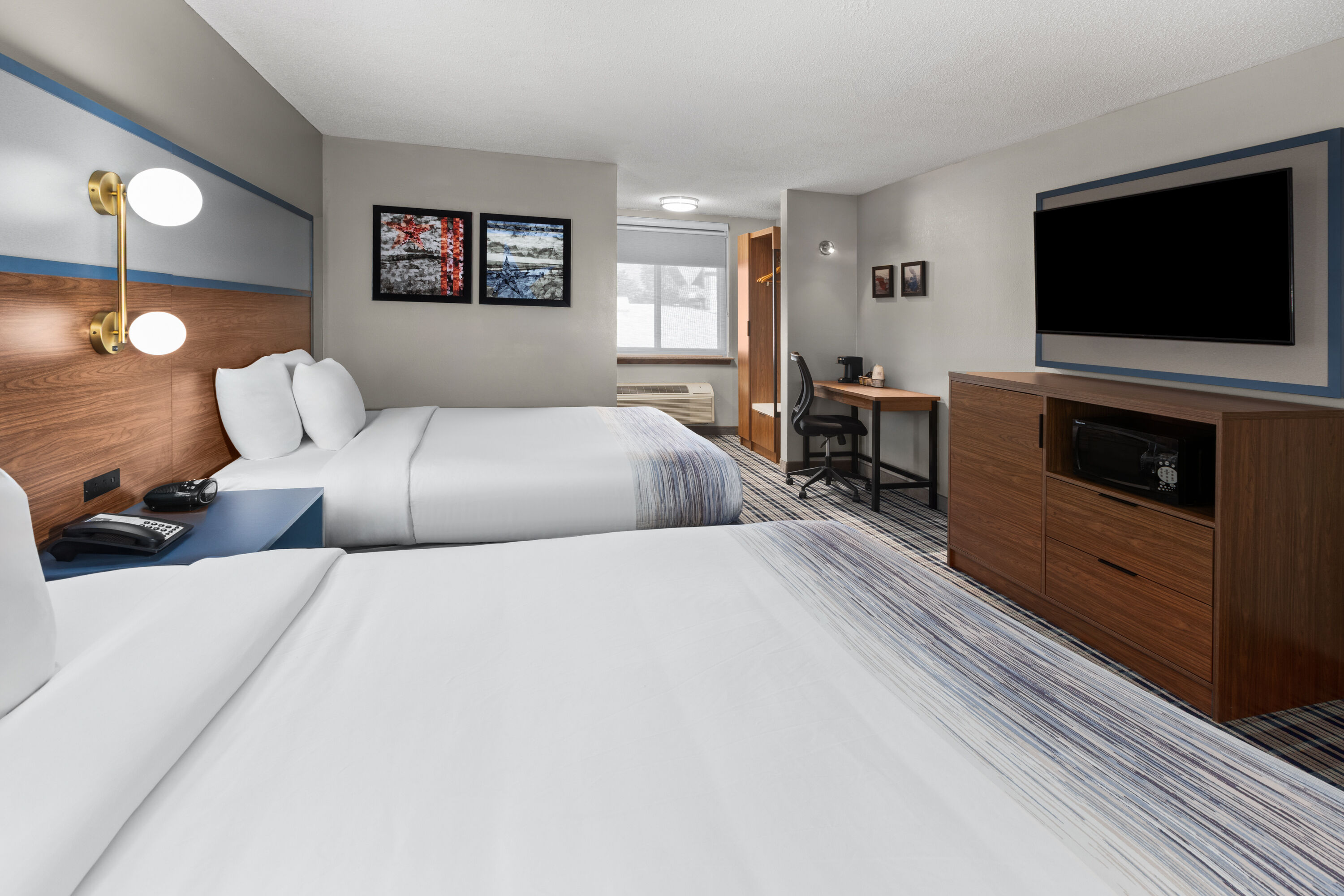 Guest room at the AmericInn by Wyndham Appleton Downtown in Appleton, Wisconsin