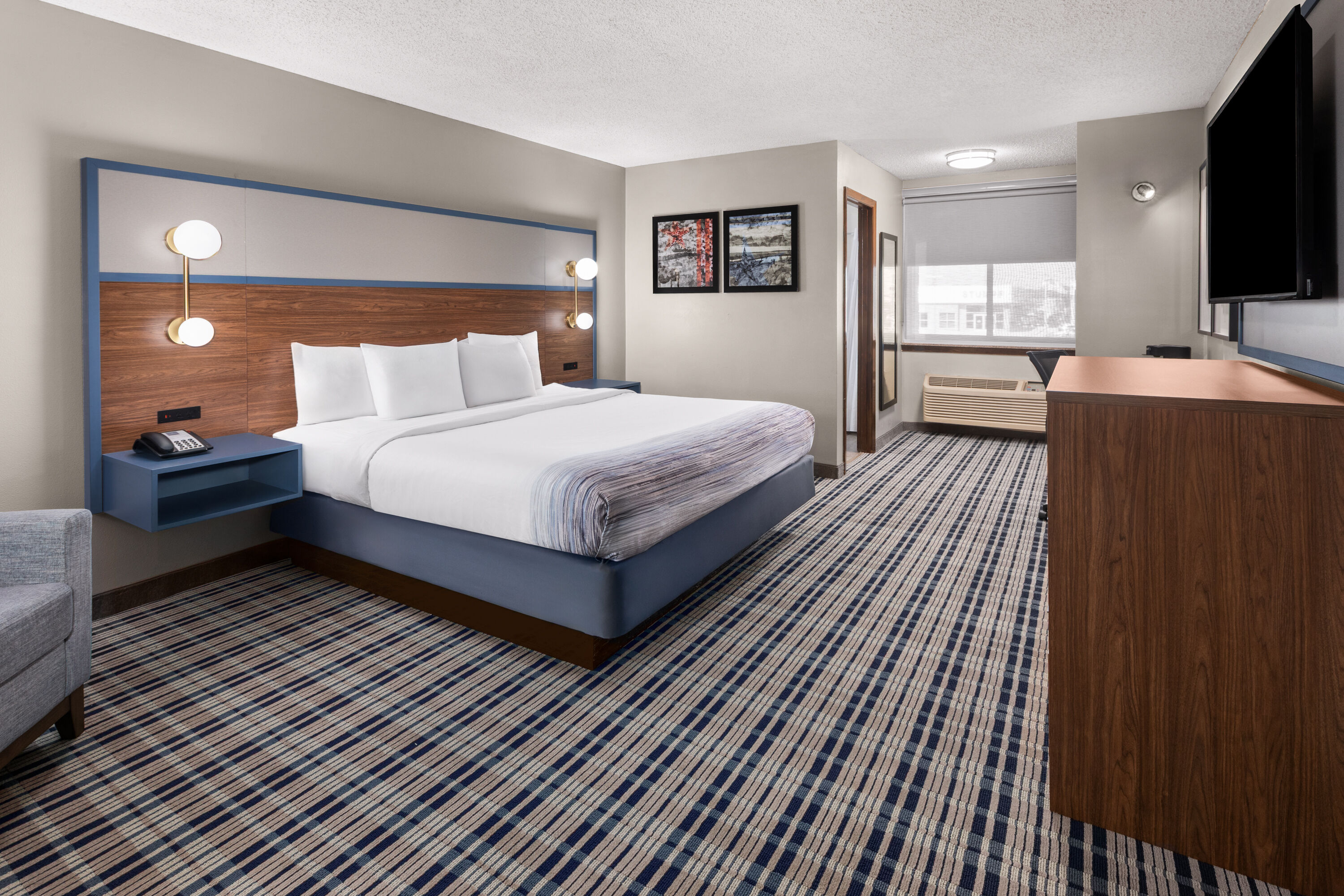 Guest room at the AmericInn by Wyndham Appleton Downtown in Appleton, Wisconsin