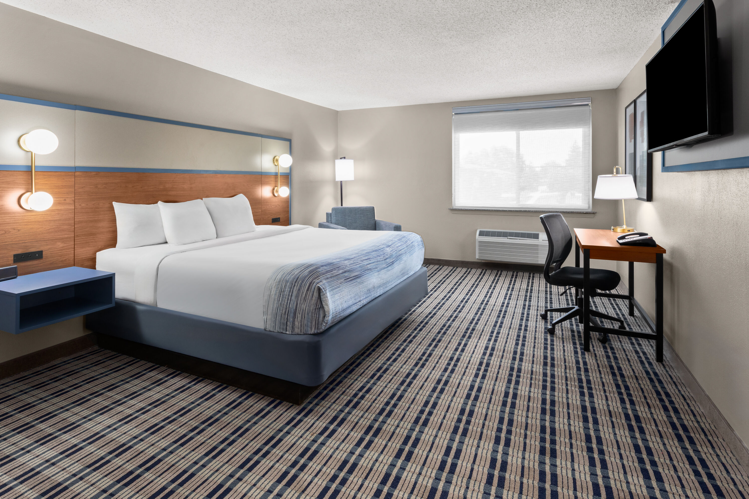 Guest room at the AmericInn by Wyndham Appleton Downtown in Appleton, Wisconsin