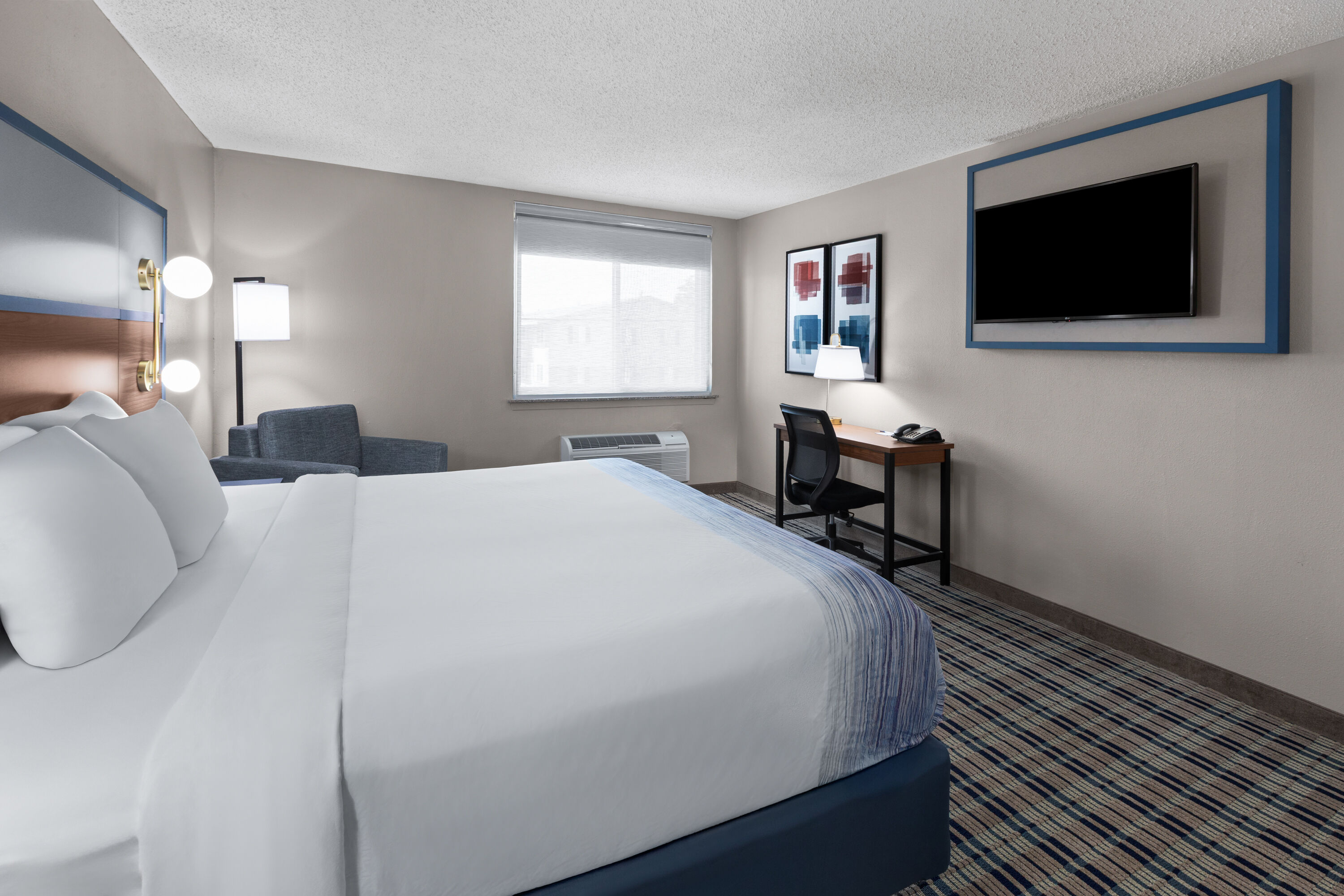 Guest room at the AmericInn by Wyndham Appleton Downtown in Appleton, Wisconsin