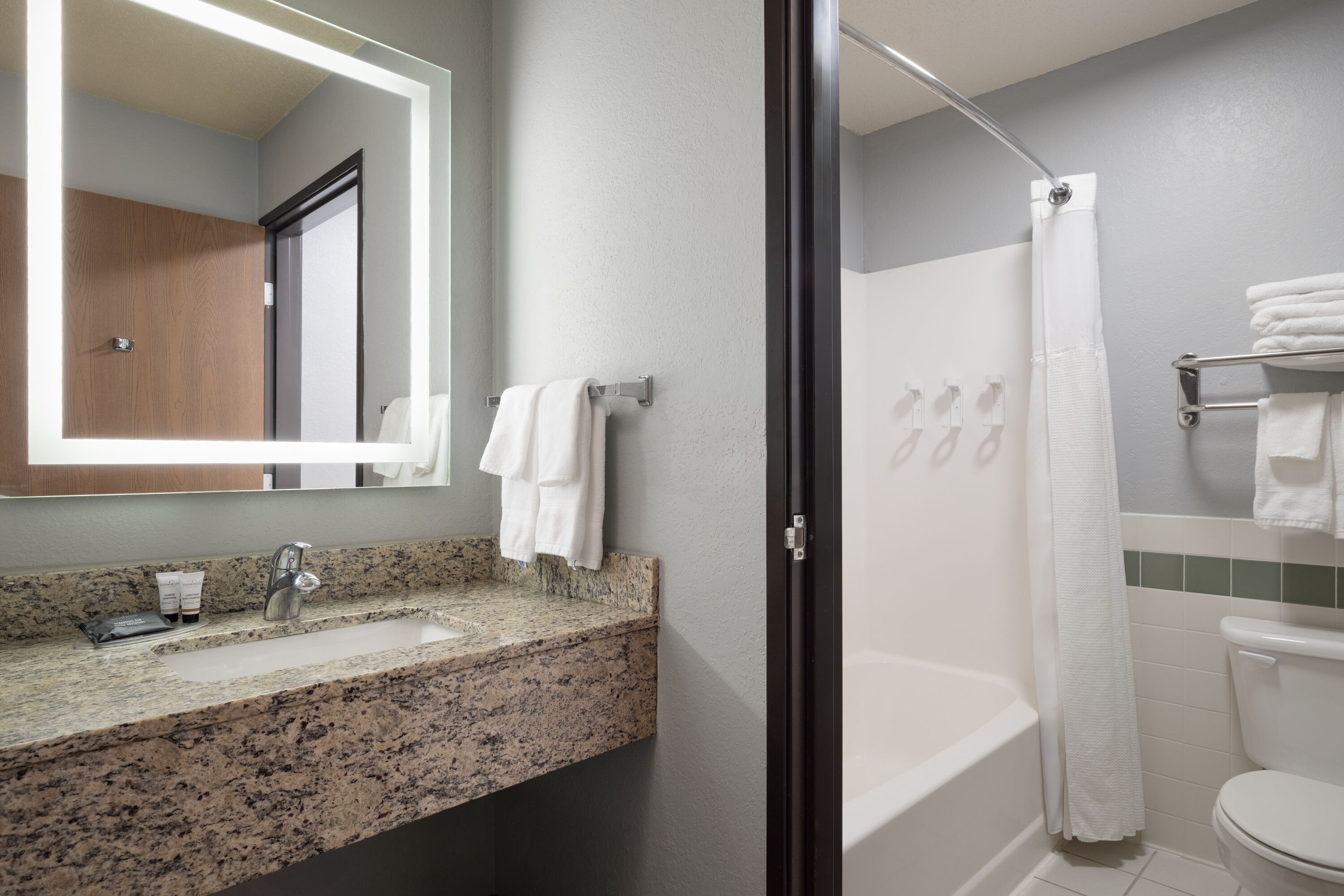 Guest room bath at the AmericInn by Wyndham Baldwin in Baldwin, Wisconsin