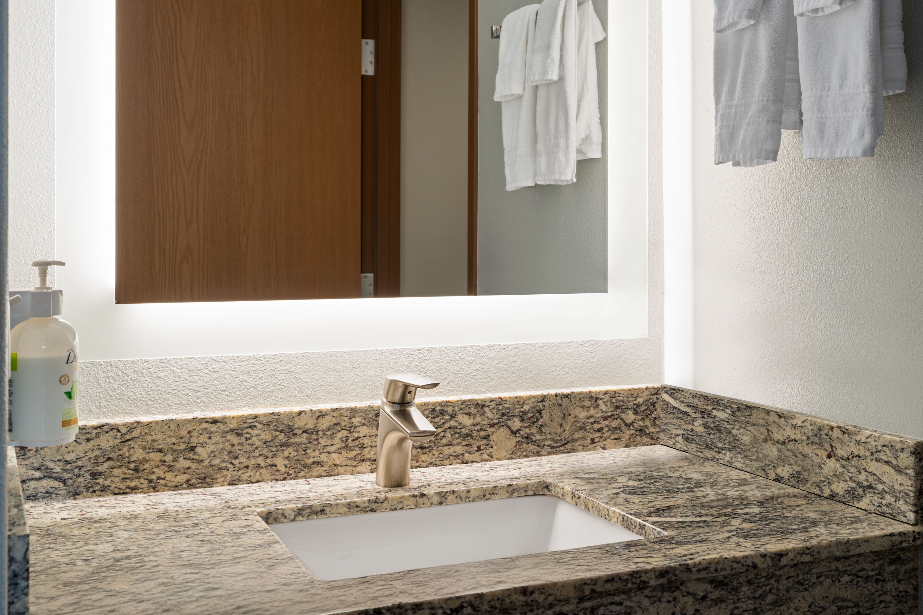 Guest room bath at the AmericInn by Wyndham Beaver Dam in Beaver Dam, Wisconsin