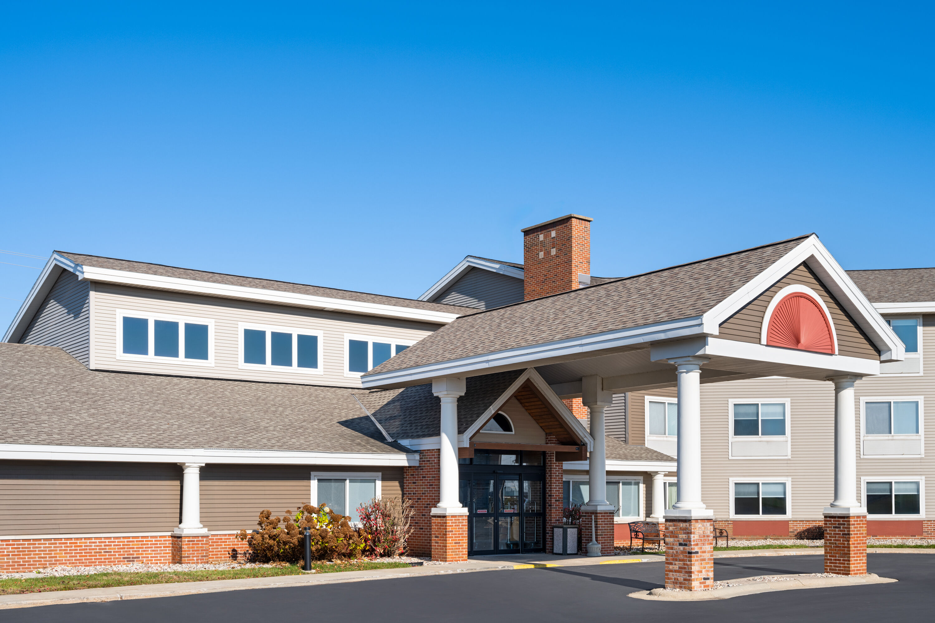Exterior Day Image of AmericInn by Wyndham Beaver Dam hotel in Beaver Dam, Wisconsin